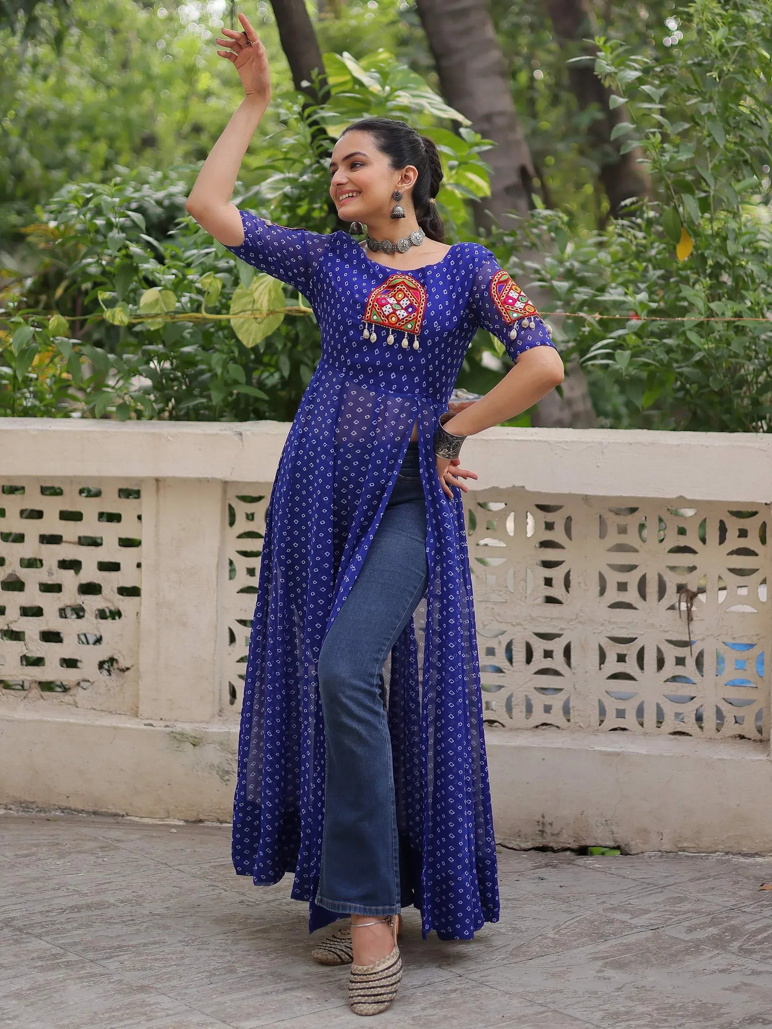 Blue printed ethnic kurta with mirror work, paired with jeans, perfect for casual Indian wear.
