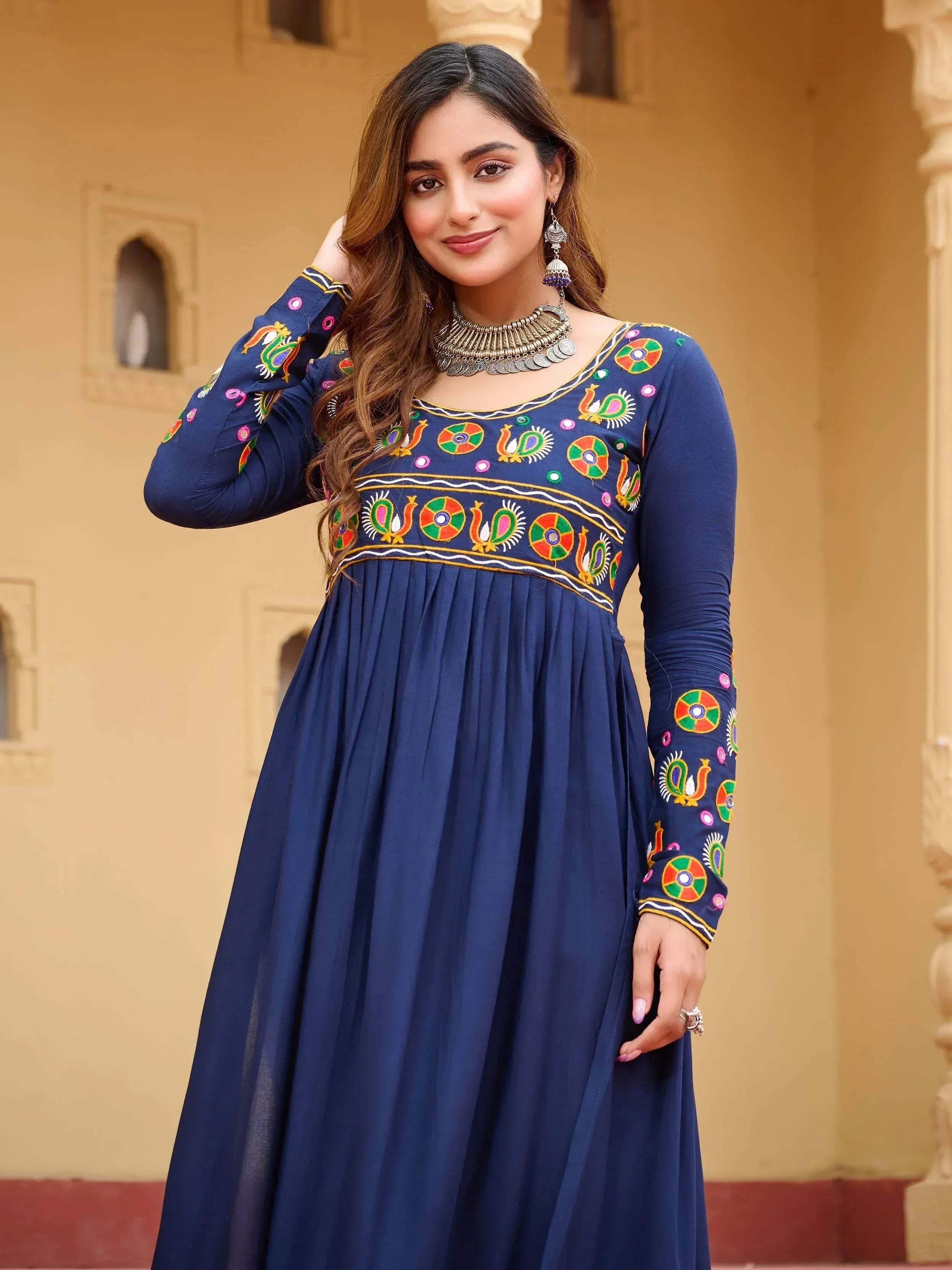Navy blue ethnic gown with colorful peacock embroidery, perfect for Indian festive occasions