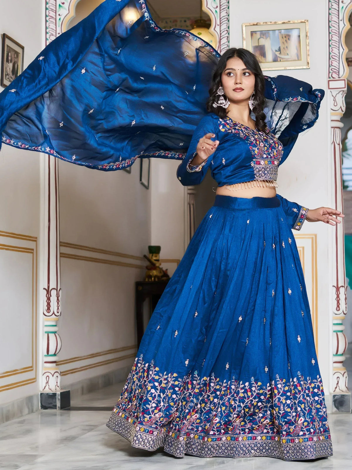 Royal blue embroidered lehenga choli with floral motifs, perfect for Indian ethnic wear and festive occasions.