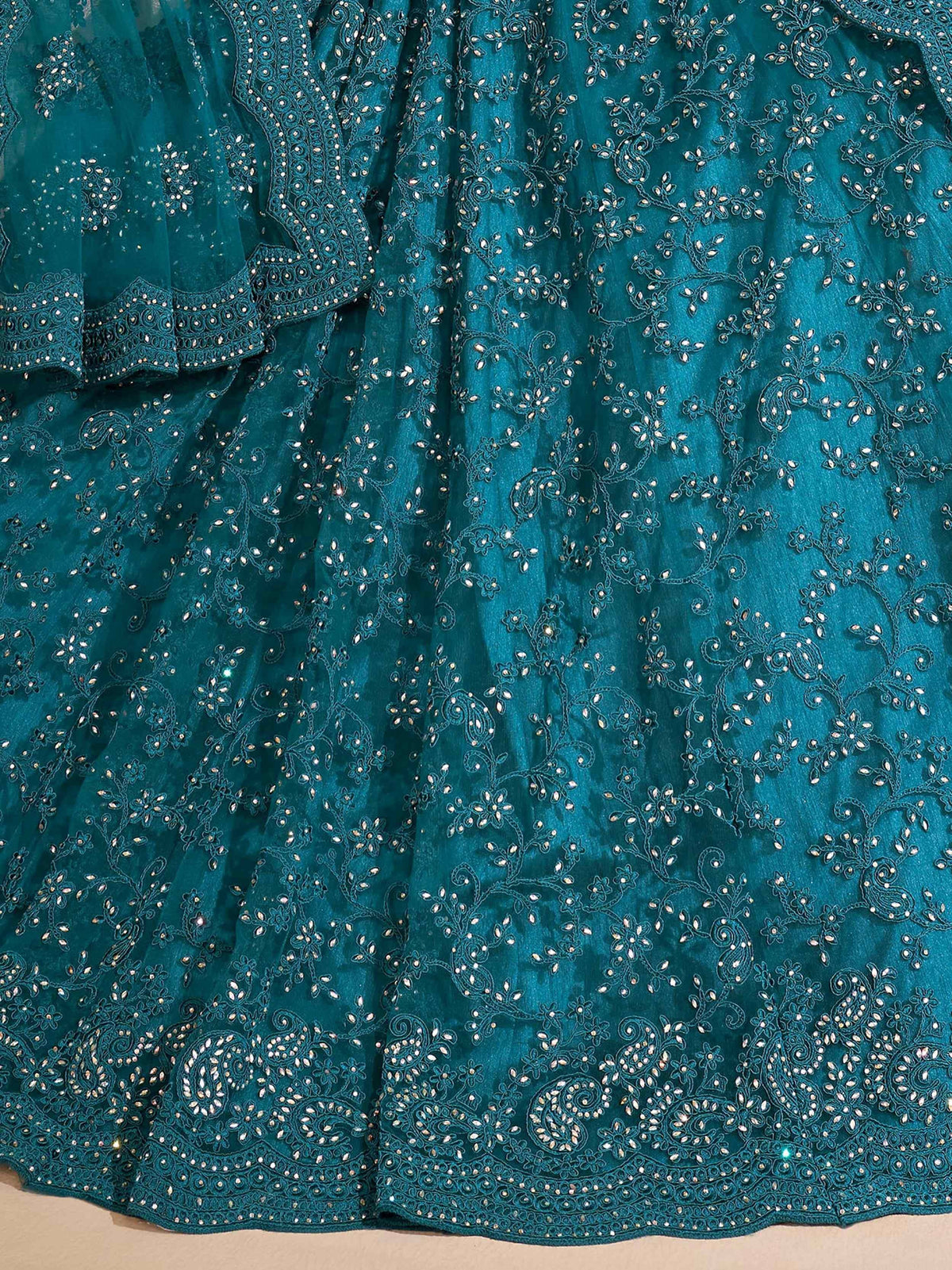 Teal designer lehenga choli with intricate floral embroidery and sequin detailing for Indian ethnic wear