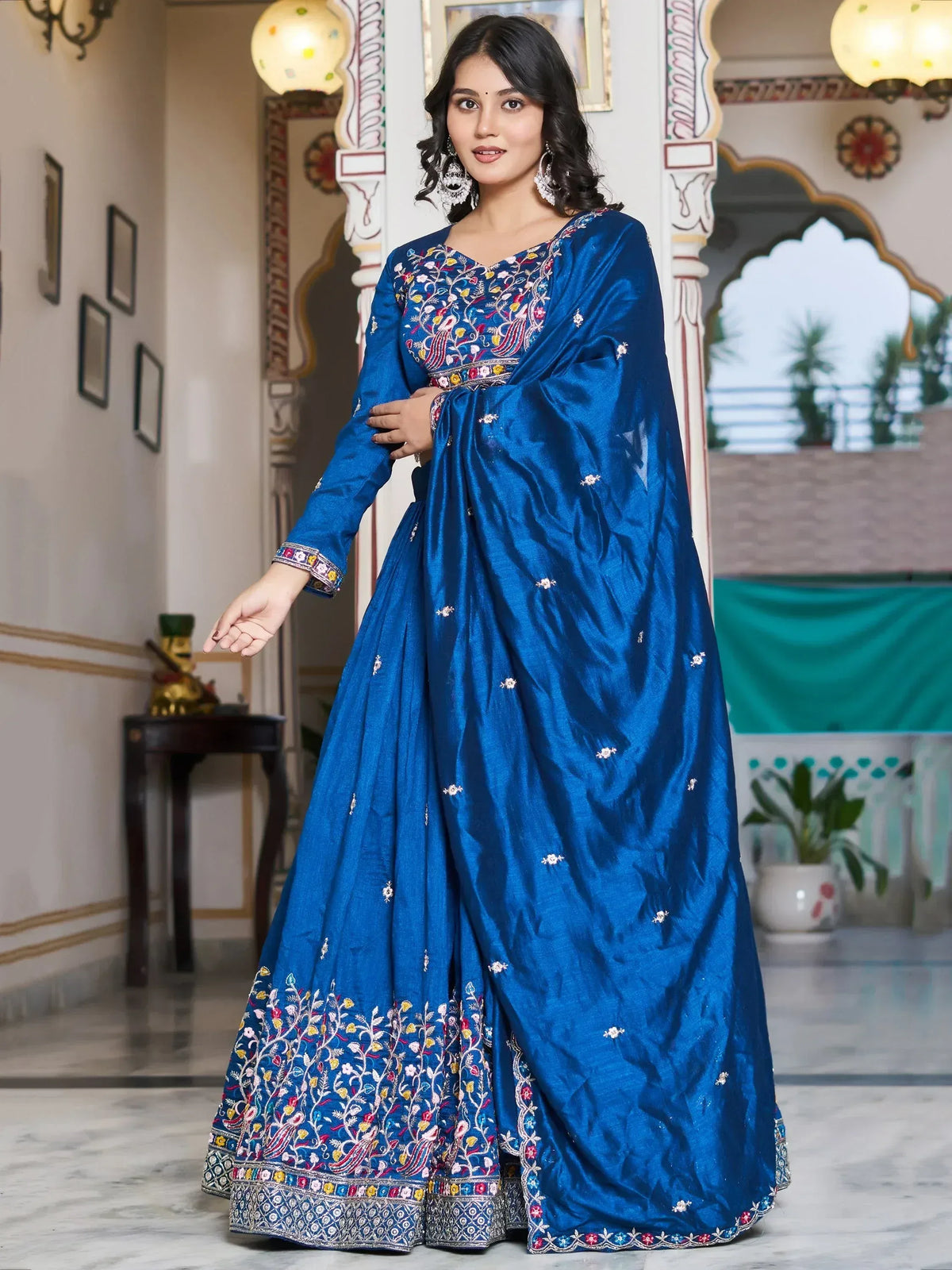 Royal blue embroidered lehenga choli with floral motifs, perfect for Indian ethnic wear and festive occasions.