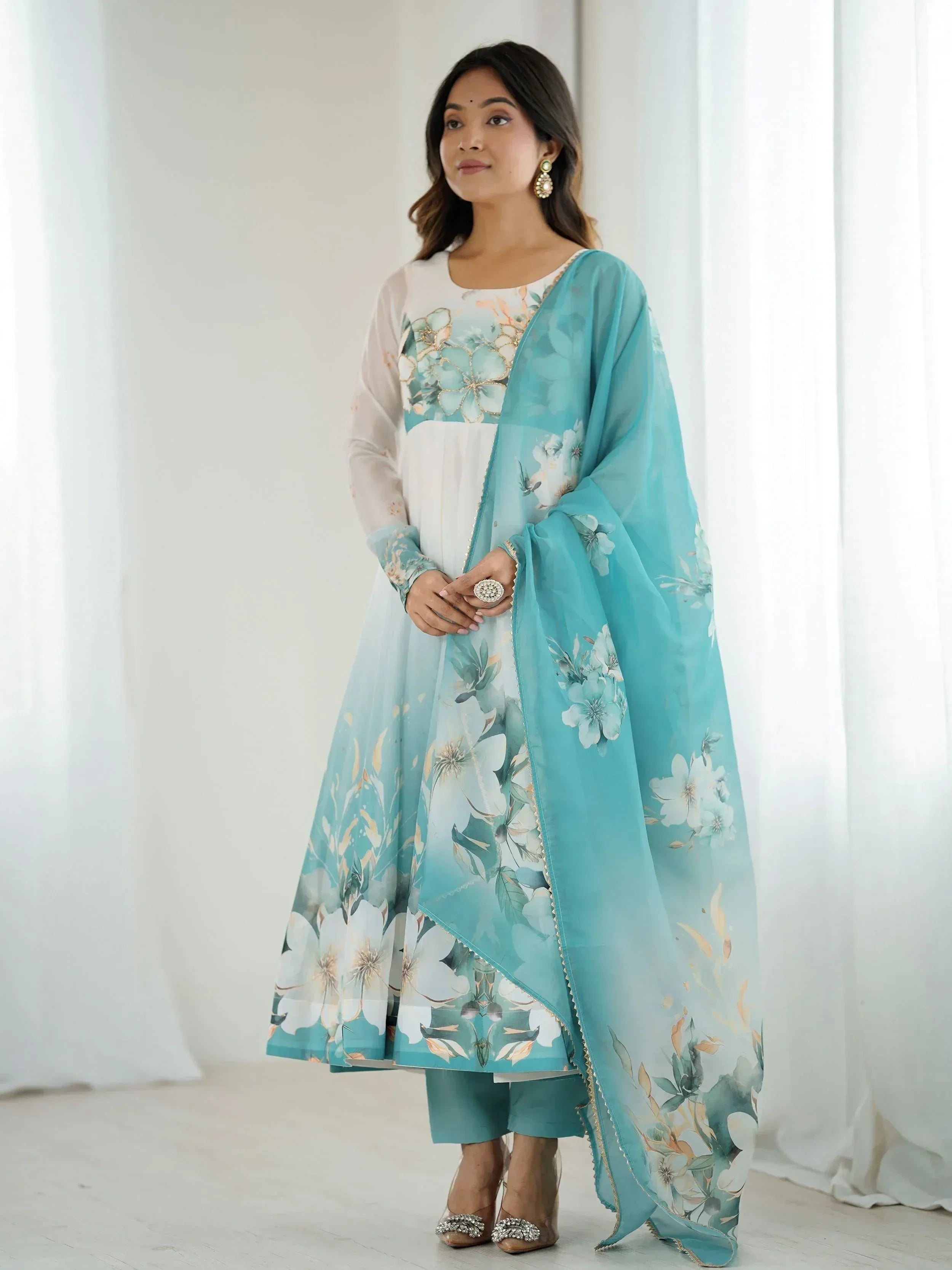 Woman in floral print Indian salwar kameez with turquoise dupatta, ethnic wear for women