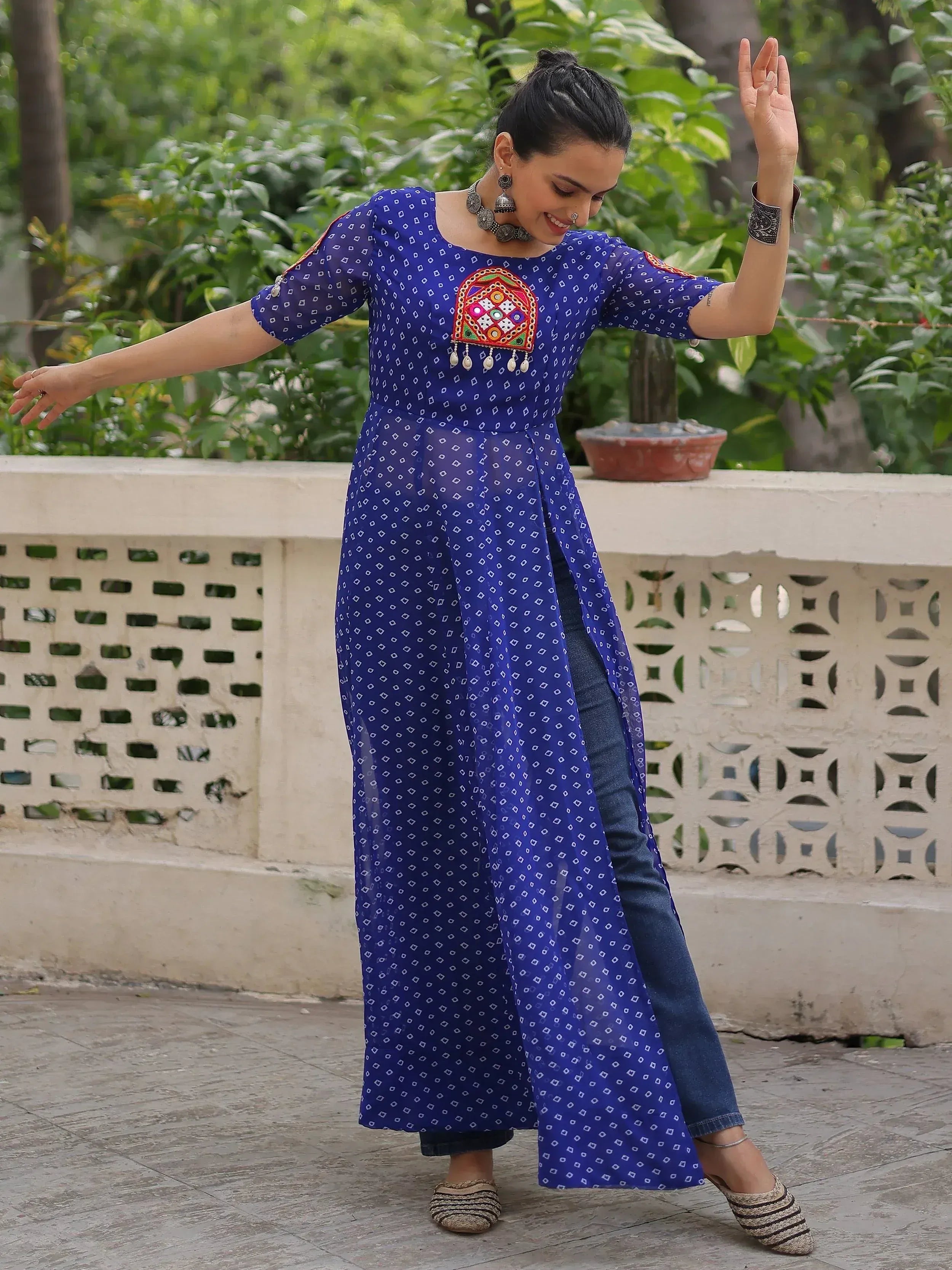 Blue printed ethnic kurta with mirror work, paired with jeans for casual Indian wear