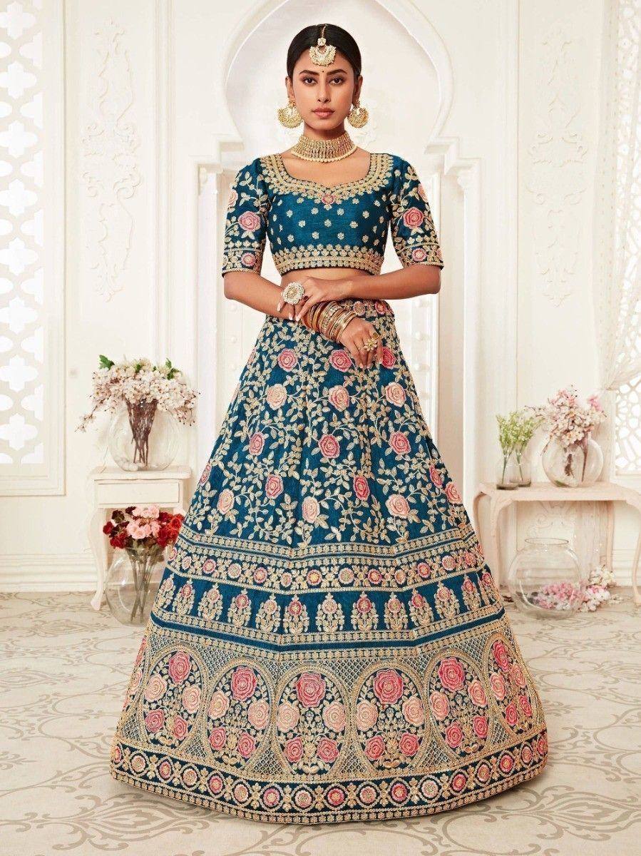 Blue floral embroidered lehenga choli with gold detailing, perfect for Indian weddings and festive occasions.