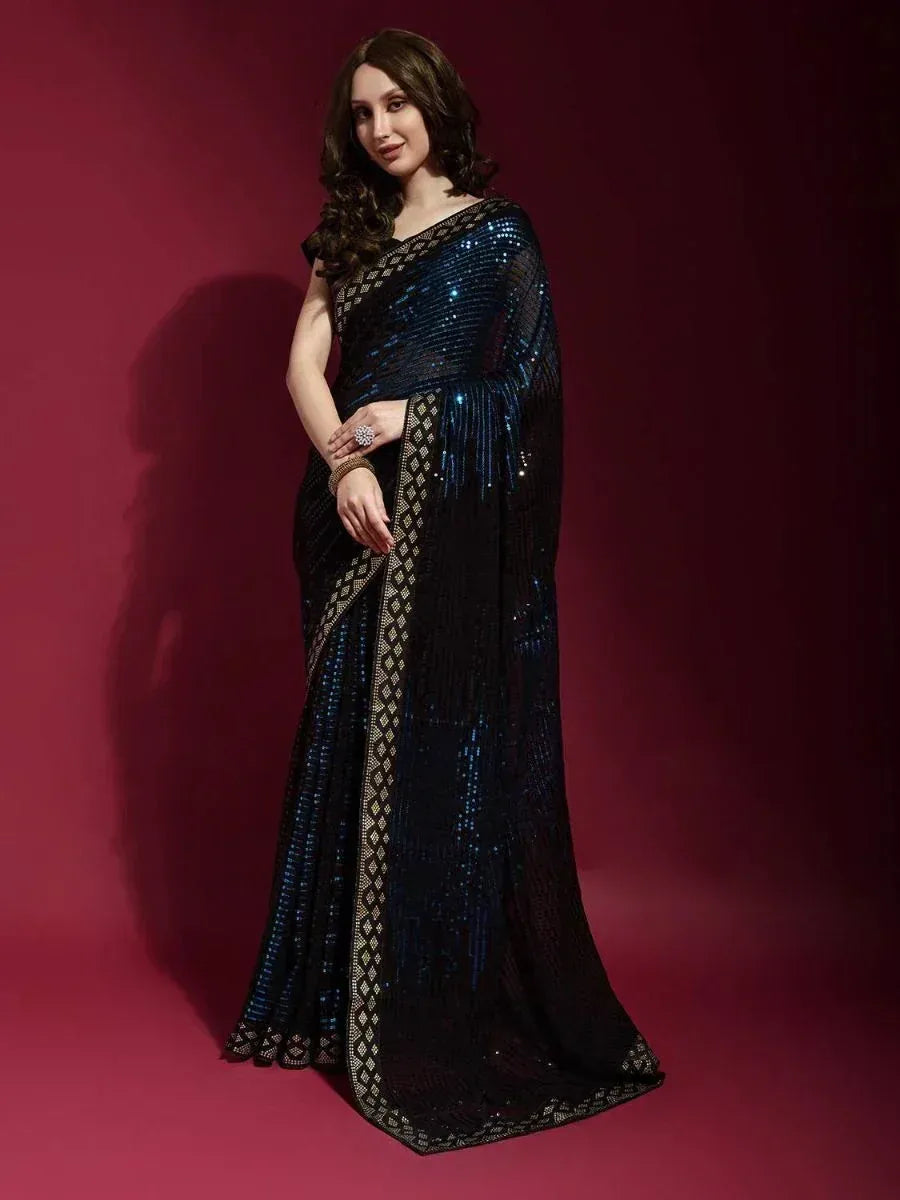 Elegant black and blue sequined saree with gold border, perfect for Indian ethnic wear occasions