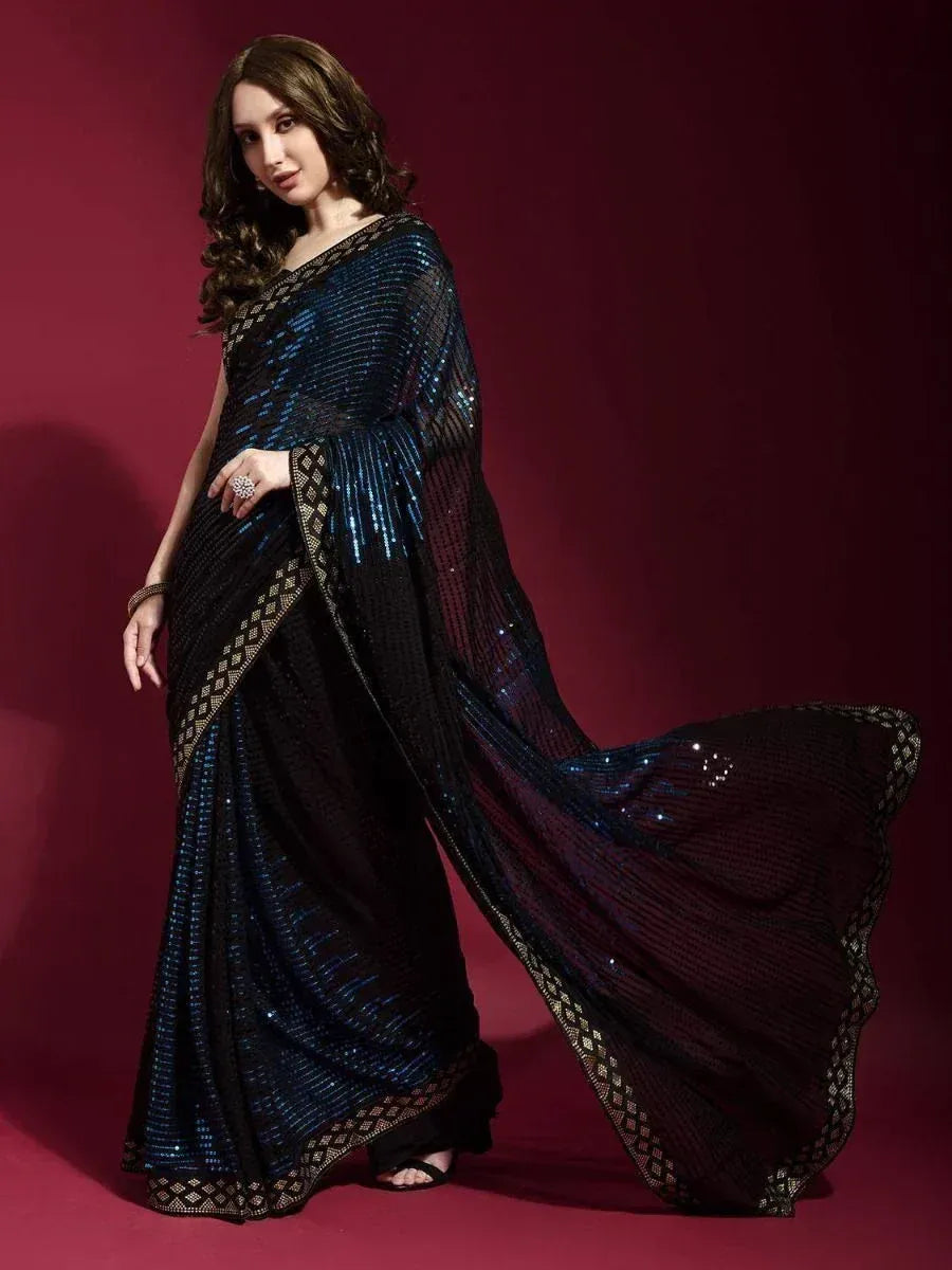 Elegant black and blue sequin saree with gold border, perfect for Indian ethnic occasions