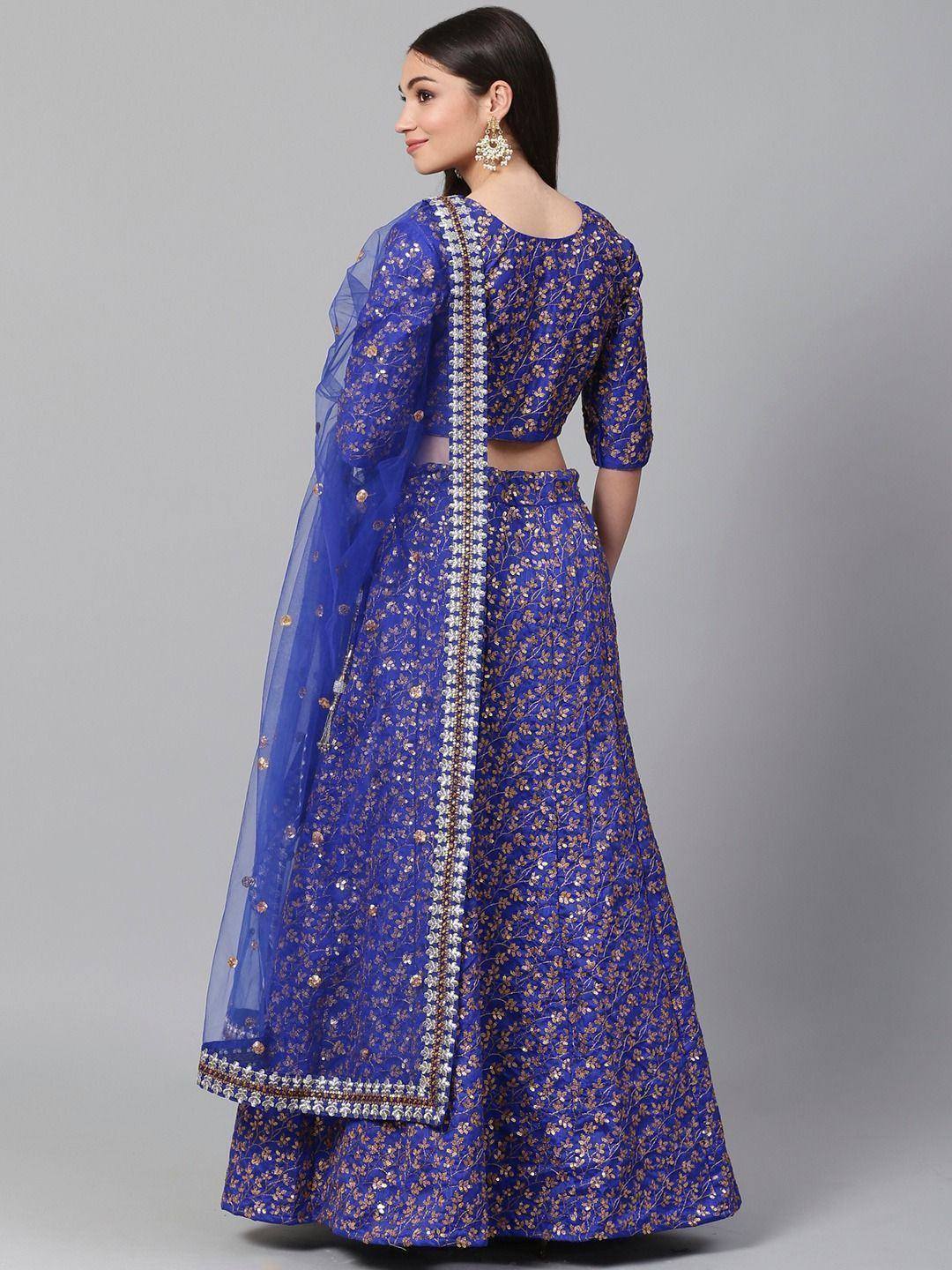 Royal blue embroidered lehenga choli with floral motifs and sheer dupatta, perfect for Indian weddings and festive occasions.