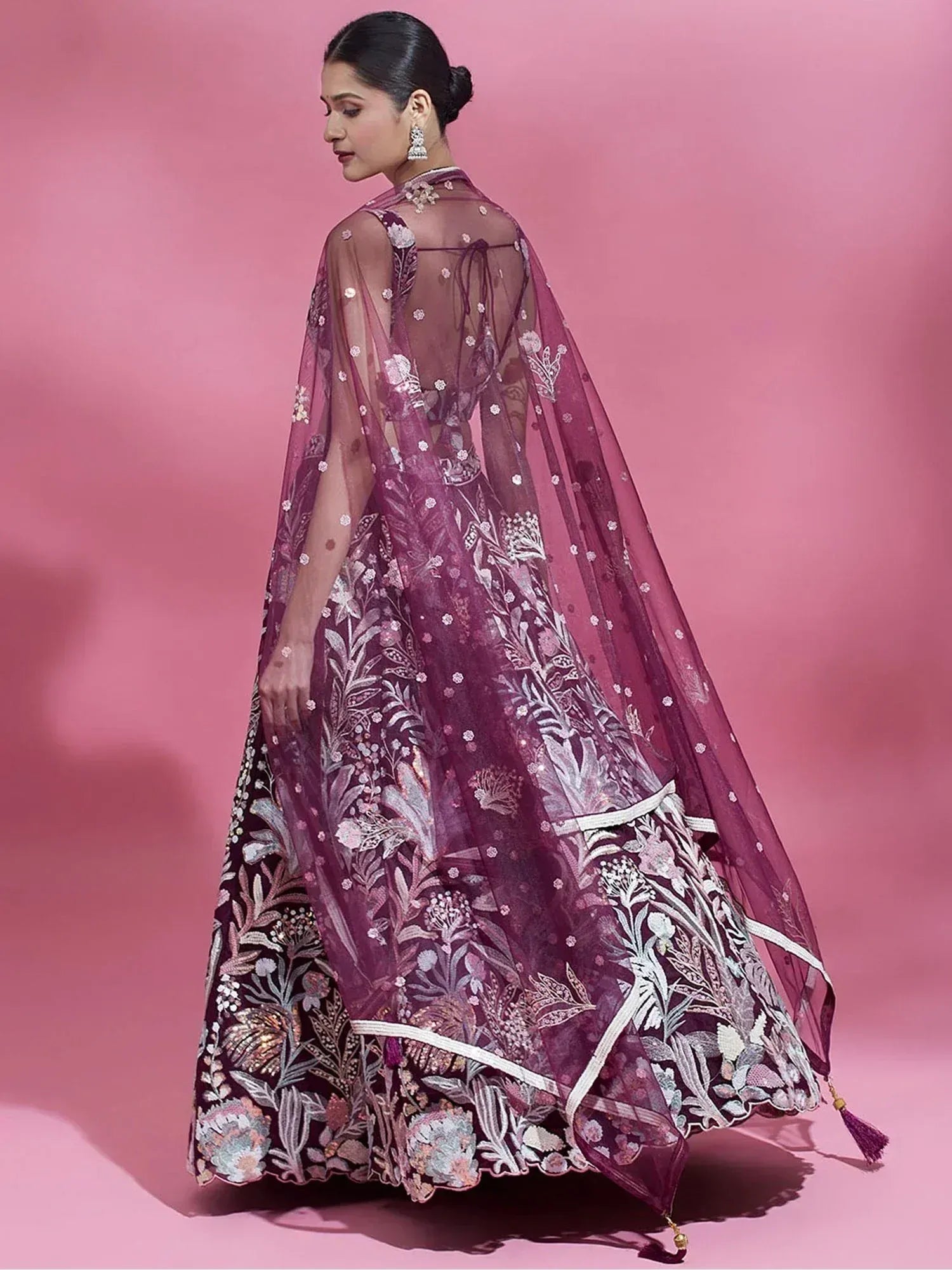 Elegant purple lehenga choli with floral embroidery and sheer cape, perfect for Indian ethnic occasions.