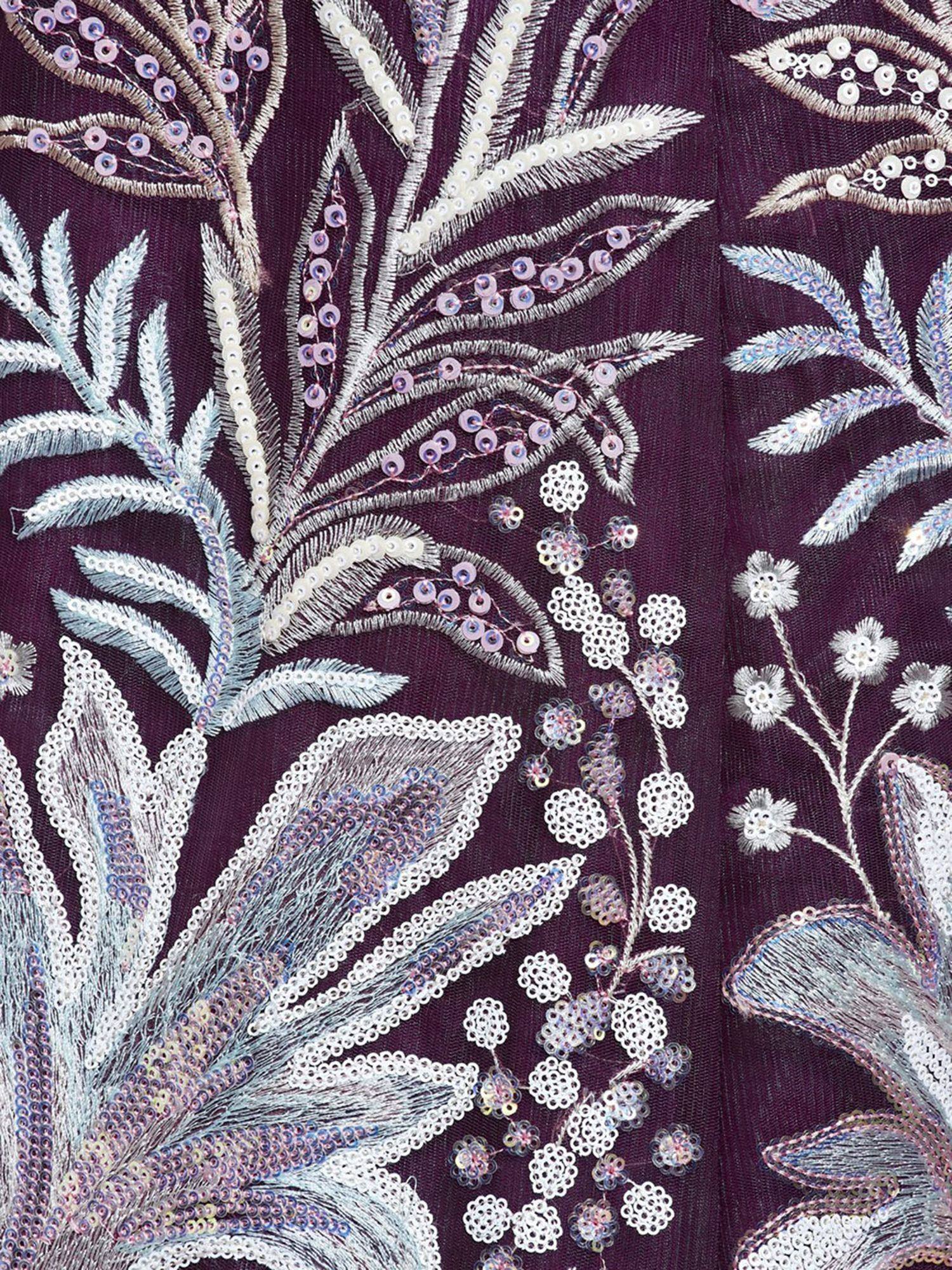 Intricate floral embroidery with sequins on deep purple ethnic wear fabric