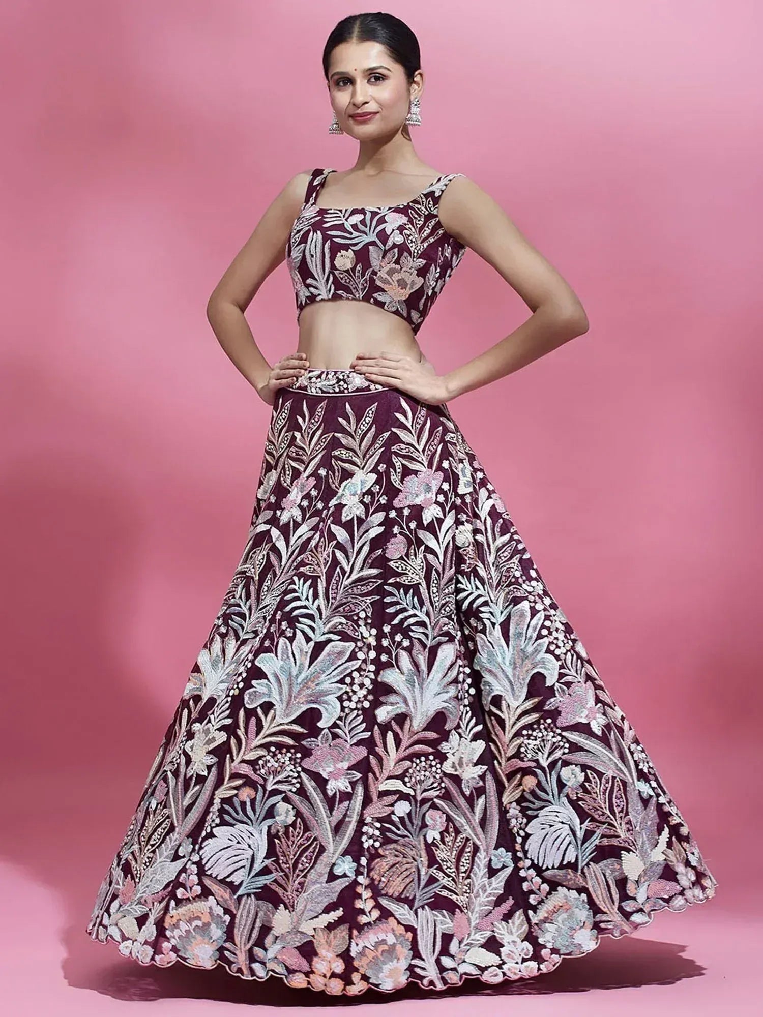 Elegant maroon lehenga choli with intricate floral embroidery, perfect for Indian ethnic occasions.