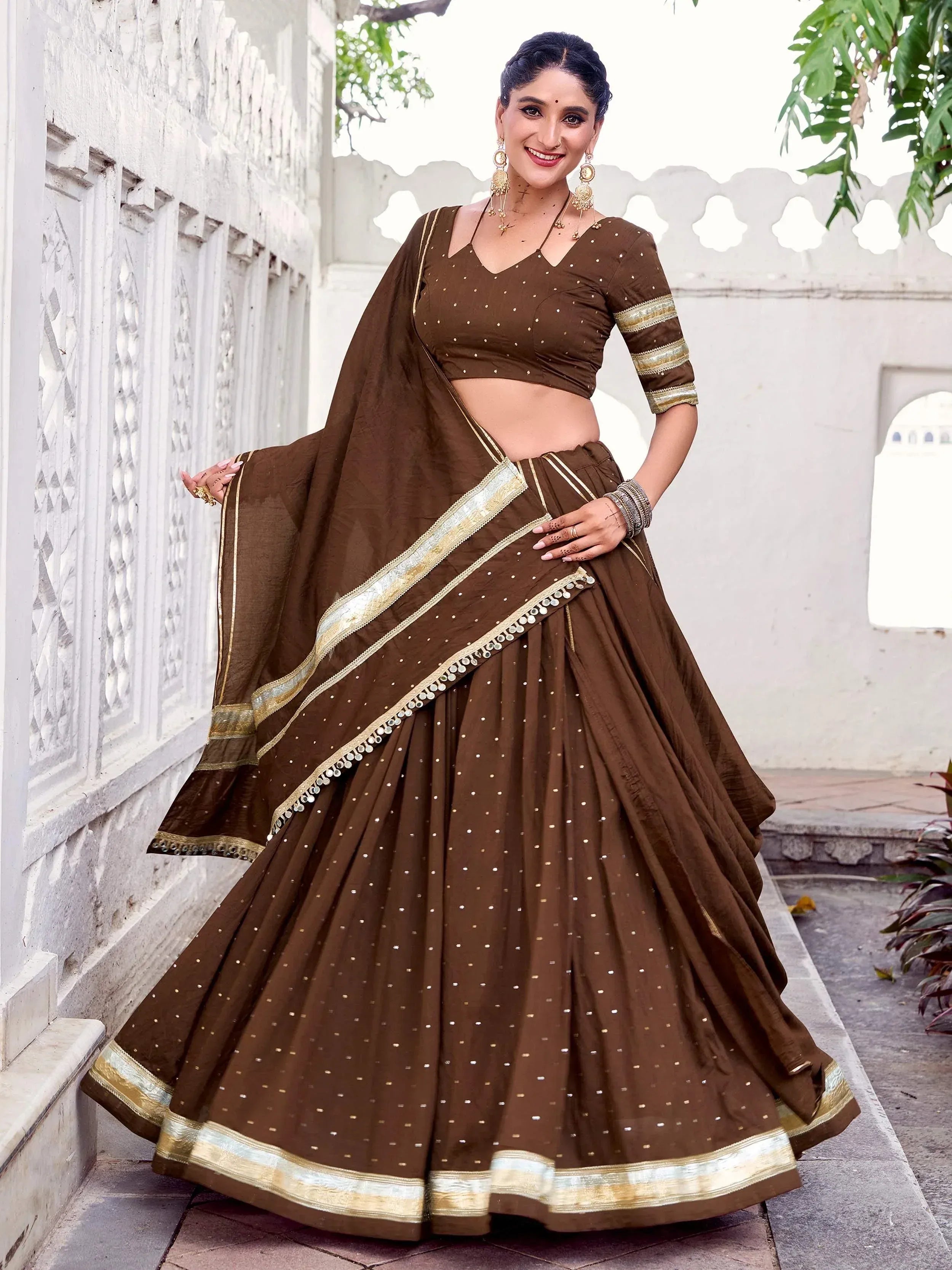 Brown designer lehenga choli with gold embroidery, perfect for Indian ethnic wear occasions