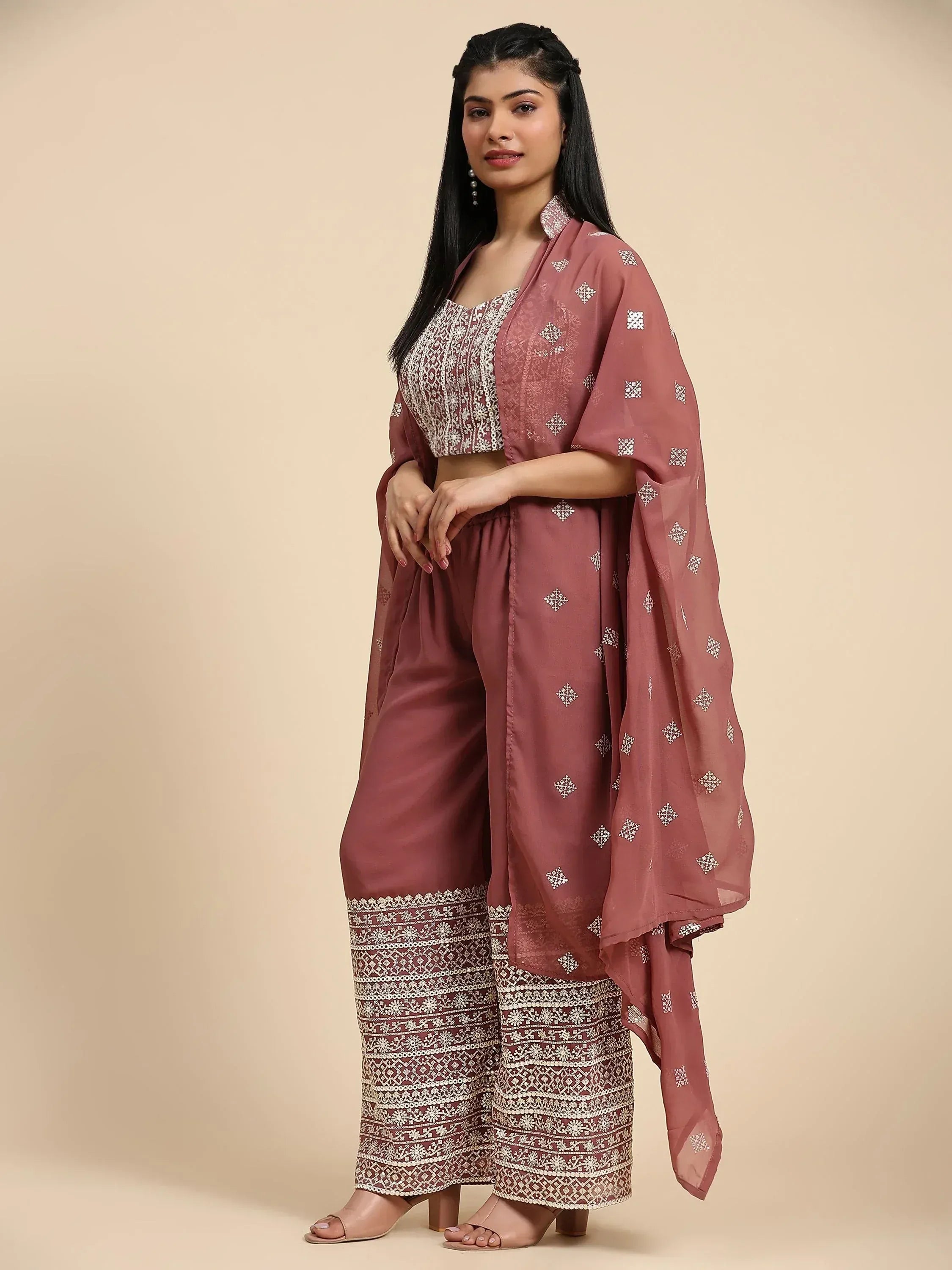 Woman wearing mauve embroidered ethnic palazzo suit with dupatta, stylish Indian attire