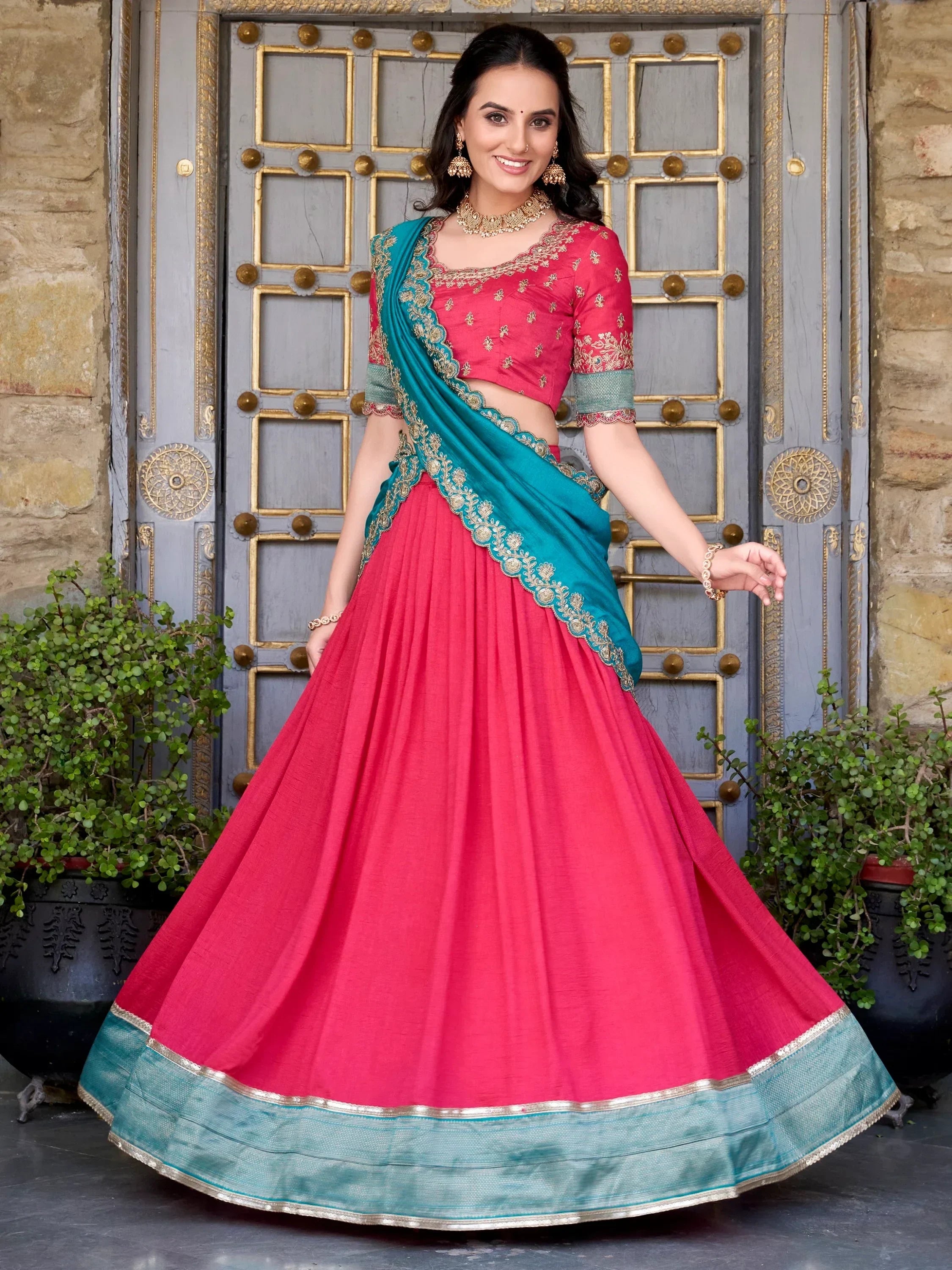 Pink and teal designer lehenga choli with gold embroidery, perfect for Indian ethnic wear occasions