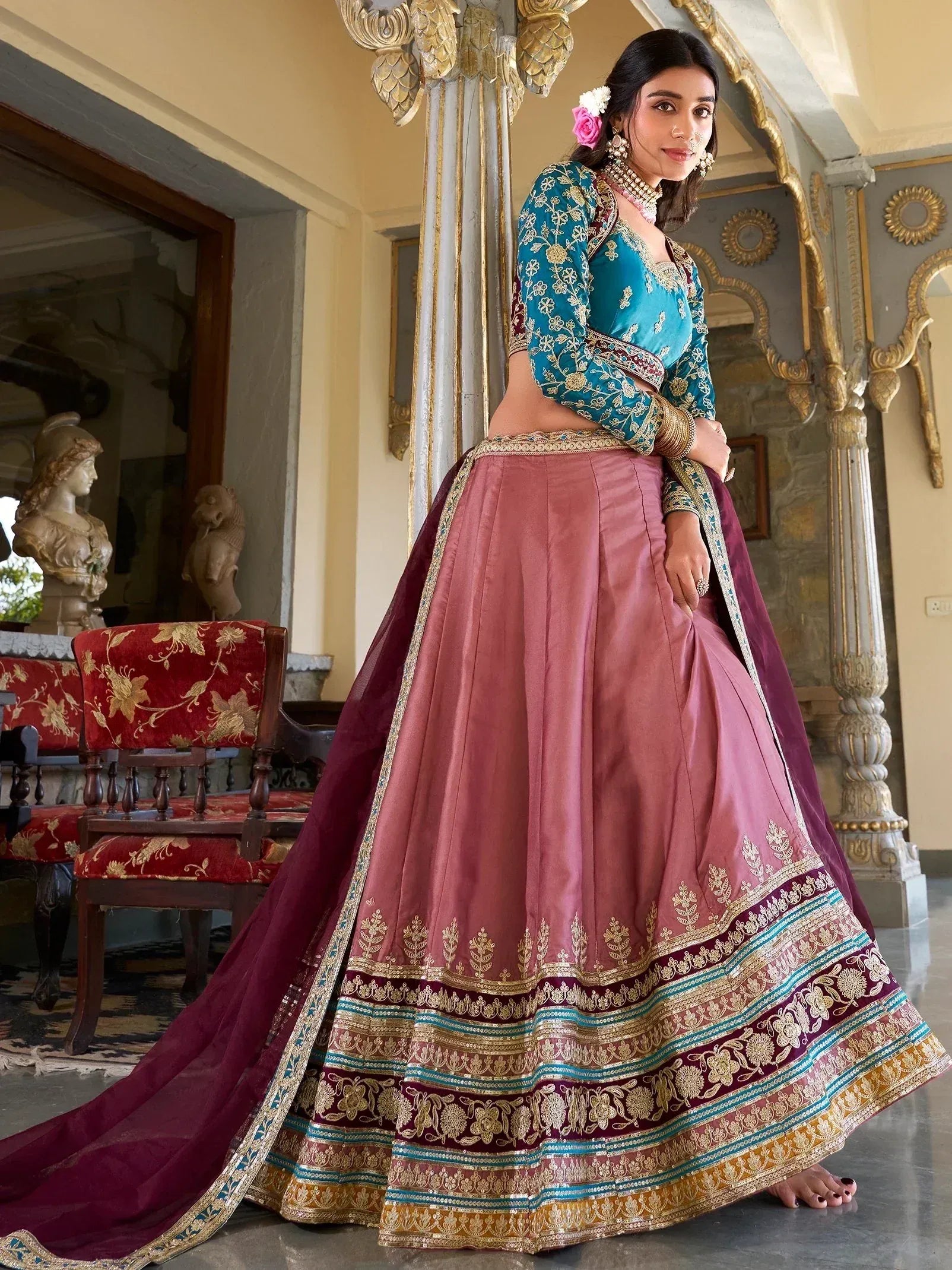 Teal and pink designer lehenga choli with gold embroidery, perfect for Indian weddings and festive occasions