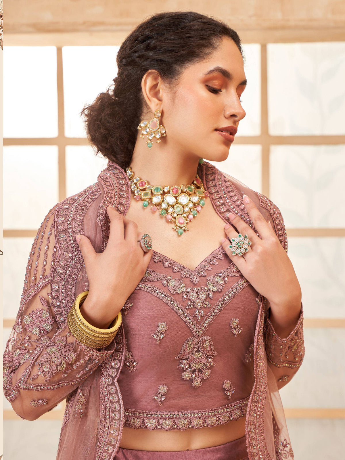 Elegant mauve embroidered lehenga choli with matching jewelry for Indian ethnic wear