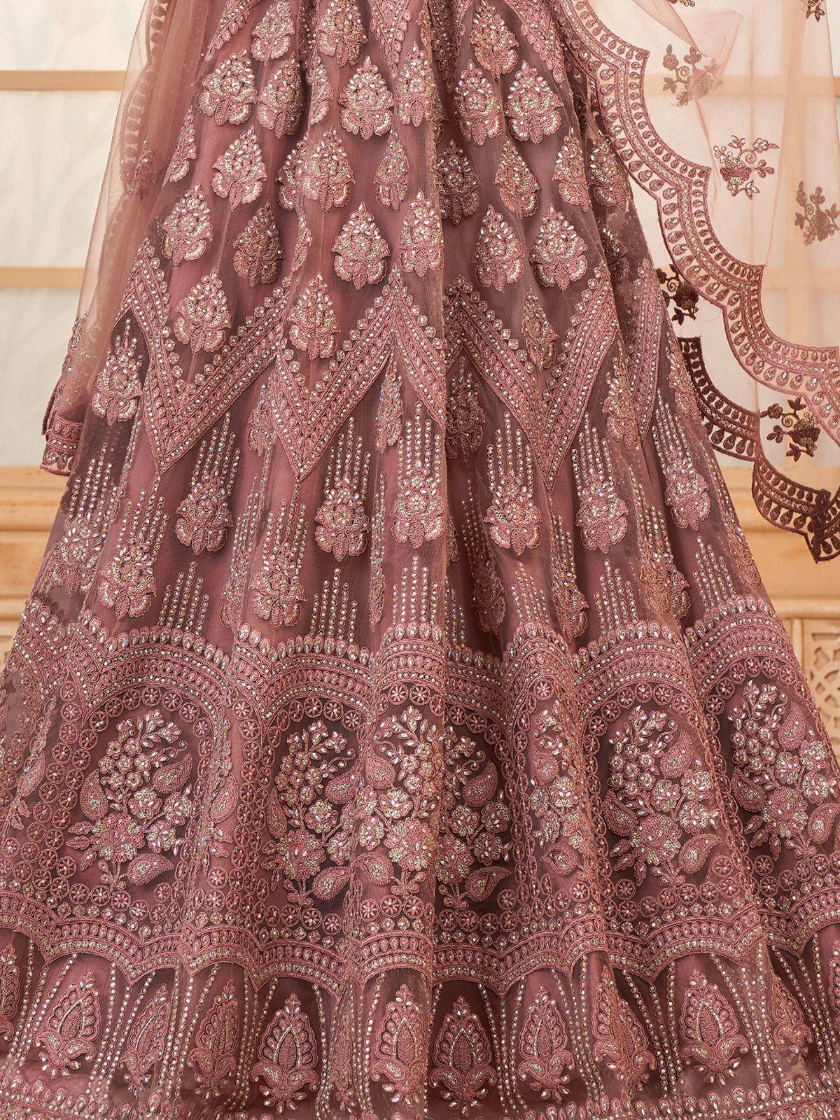 Elegant mauve lehenga with intricate floral embroidery and beadwork, perfect for Indian ethnic occasions.