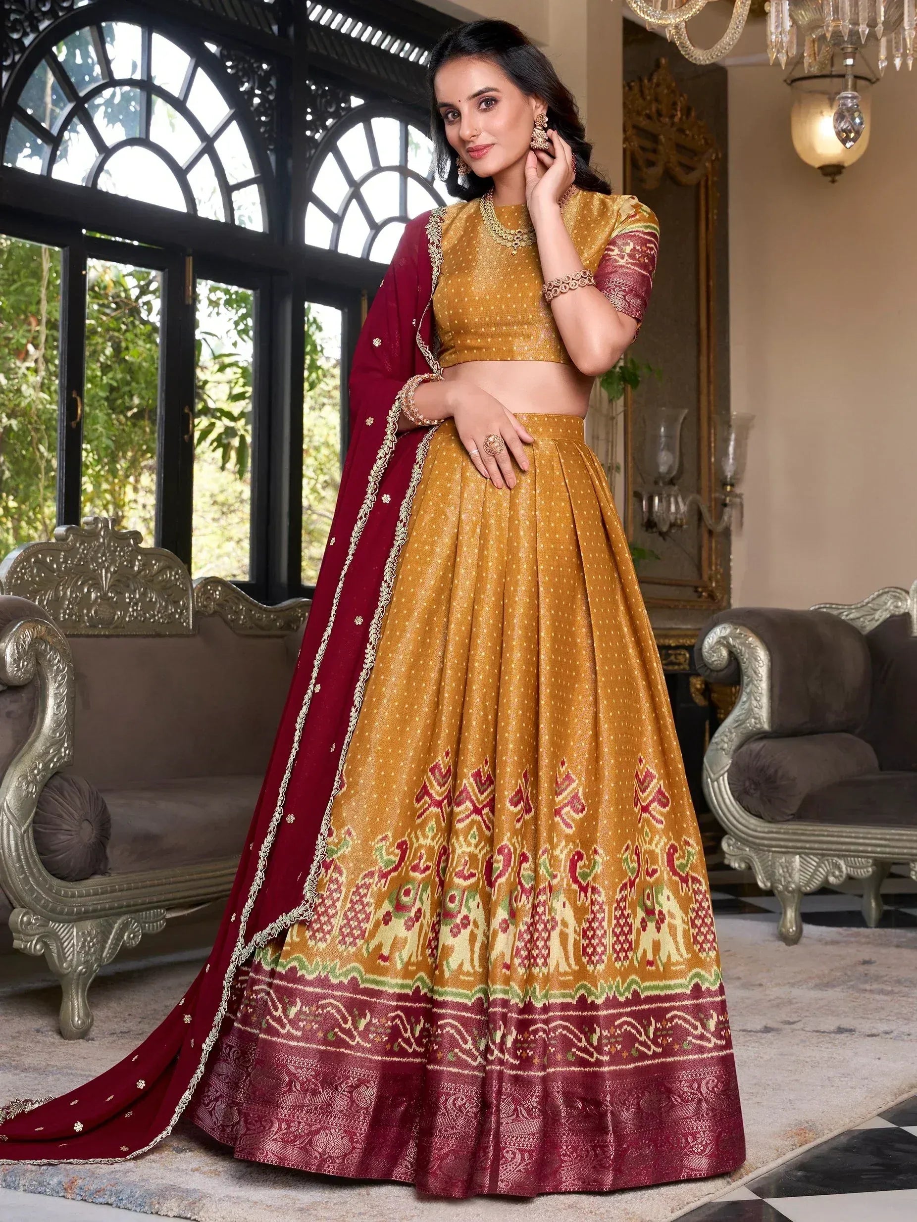 Elegant mustard and maroon lehenga choli with elephant motifs, perfect for Indian ethnic wear.