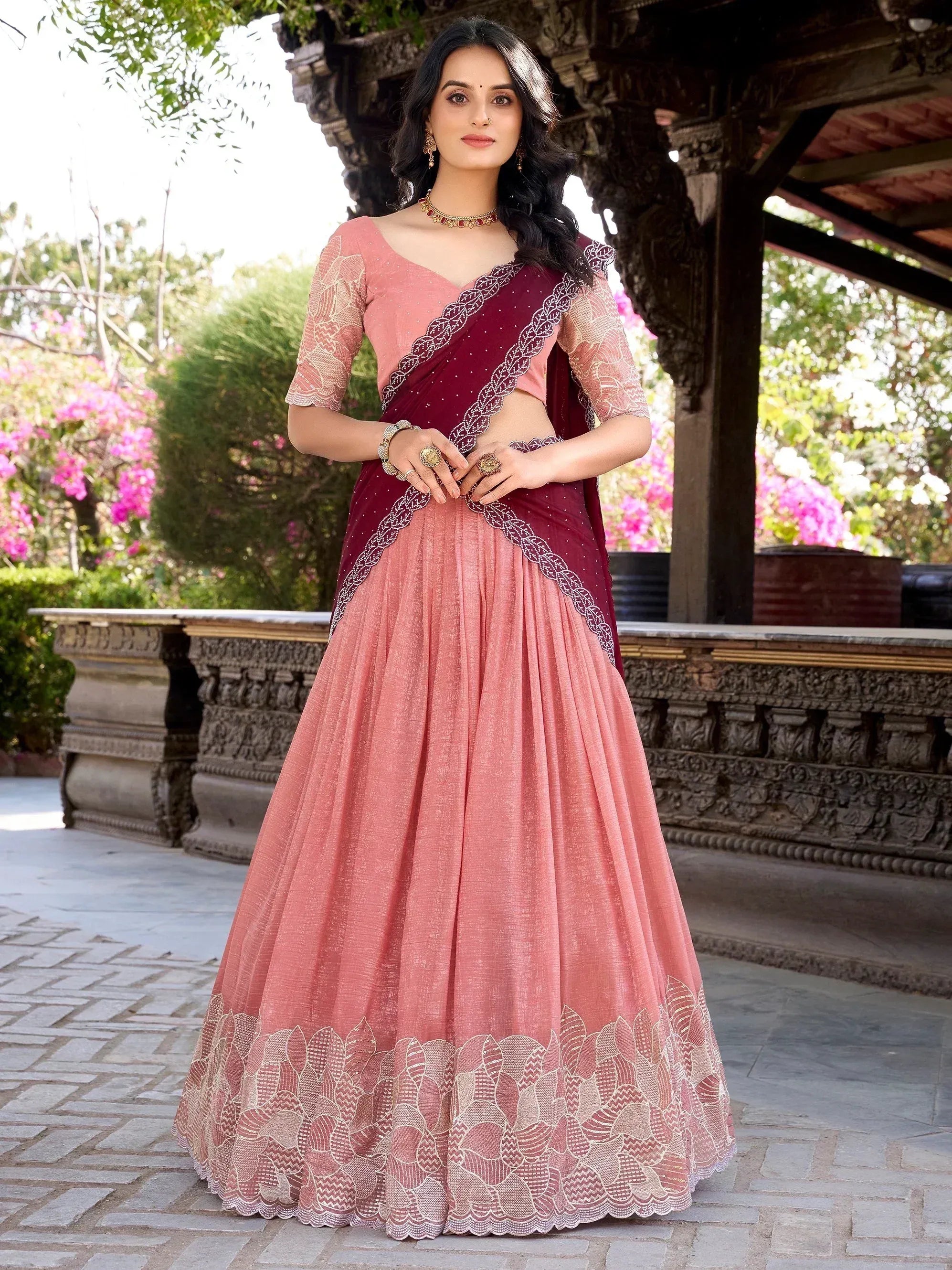 Pink and maroon designer lehenga choli with embroidered border, perfect for Indian ethnic wear occasions