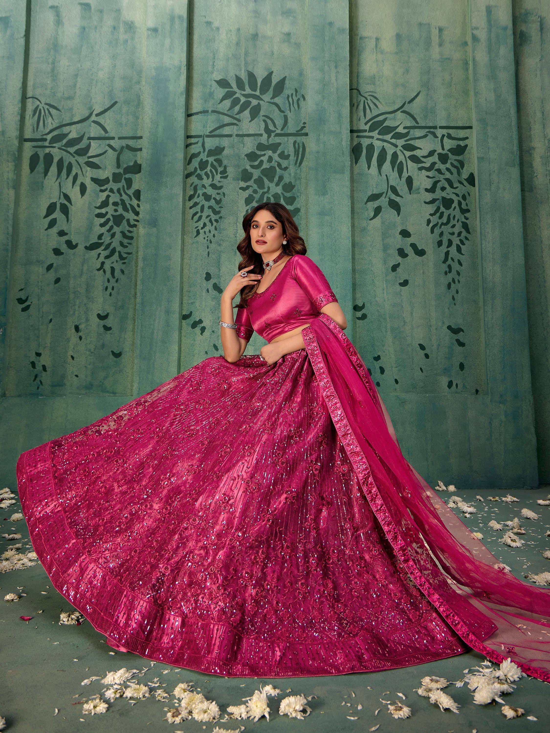 Fuchsia designer lehenga choli with sequin embroidery, perfect for Indian weddings and festive occasions.
