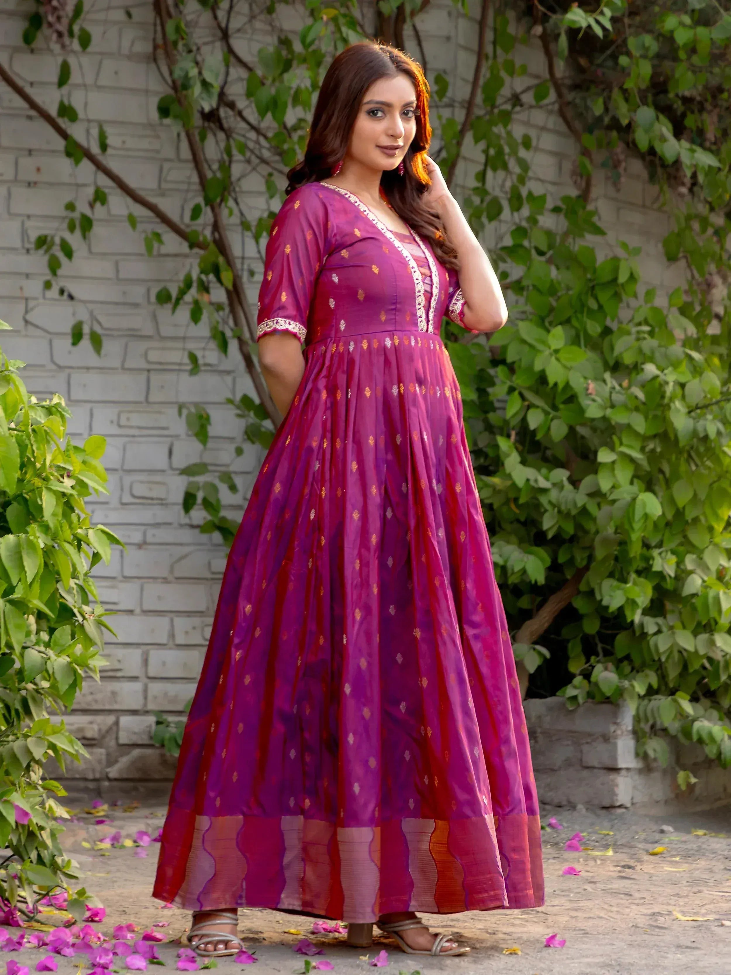 Purple ethnic gown with gold embroidery, perfect for festive occasions