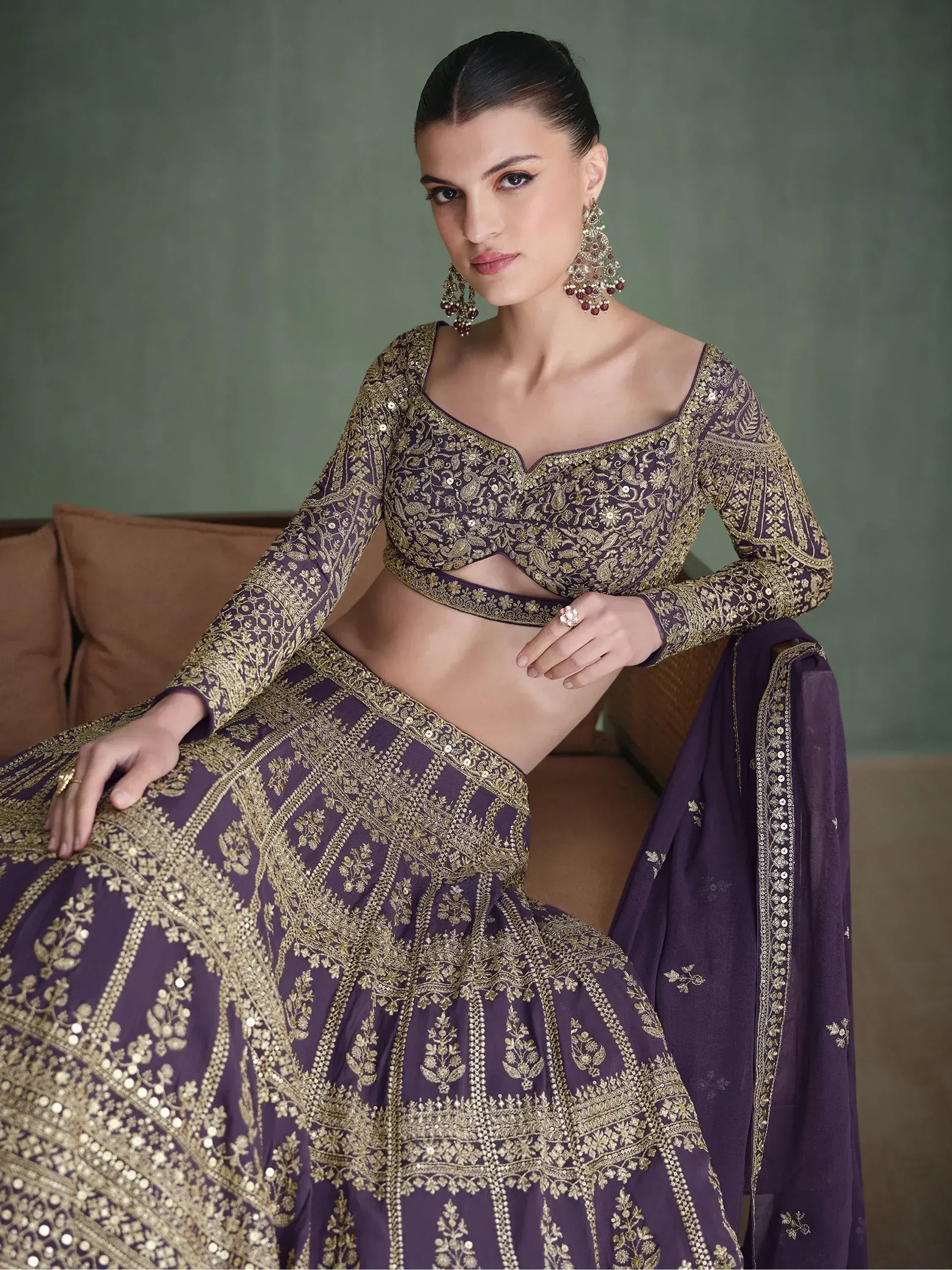Purple and gold embroidered lehenga choli with intricate floral patterns, perfect for Indian ethnic wear.