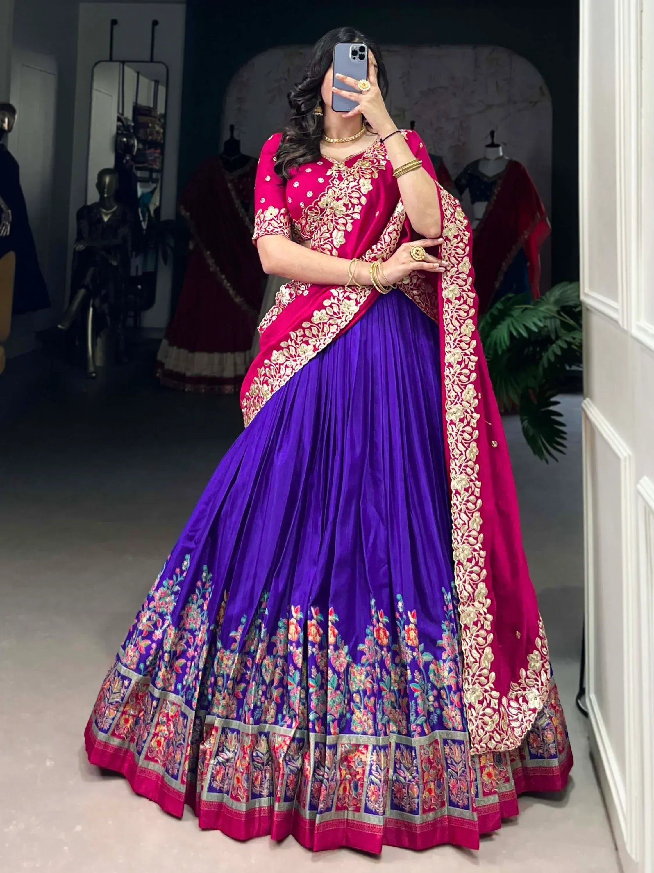 Purple and pink embroidered lehenga choli with floral border, perfect for Indian ethnic wear occasions