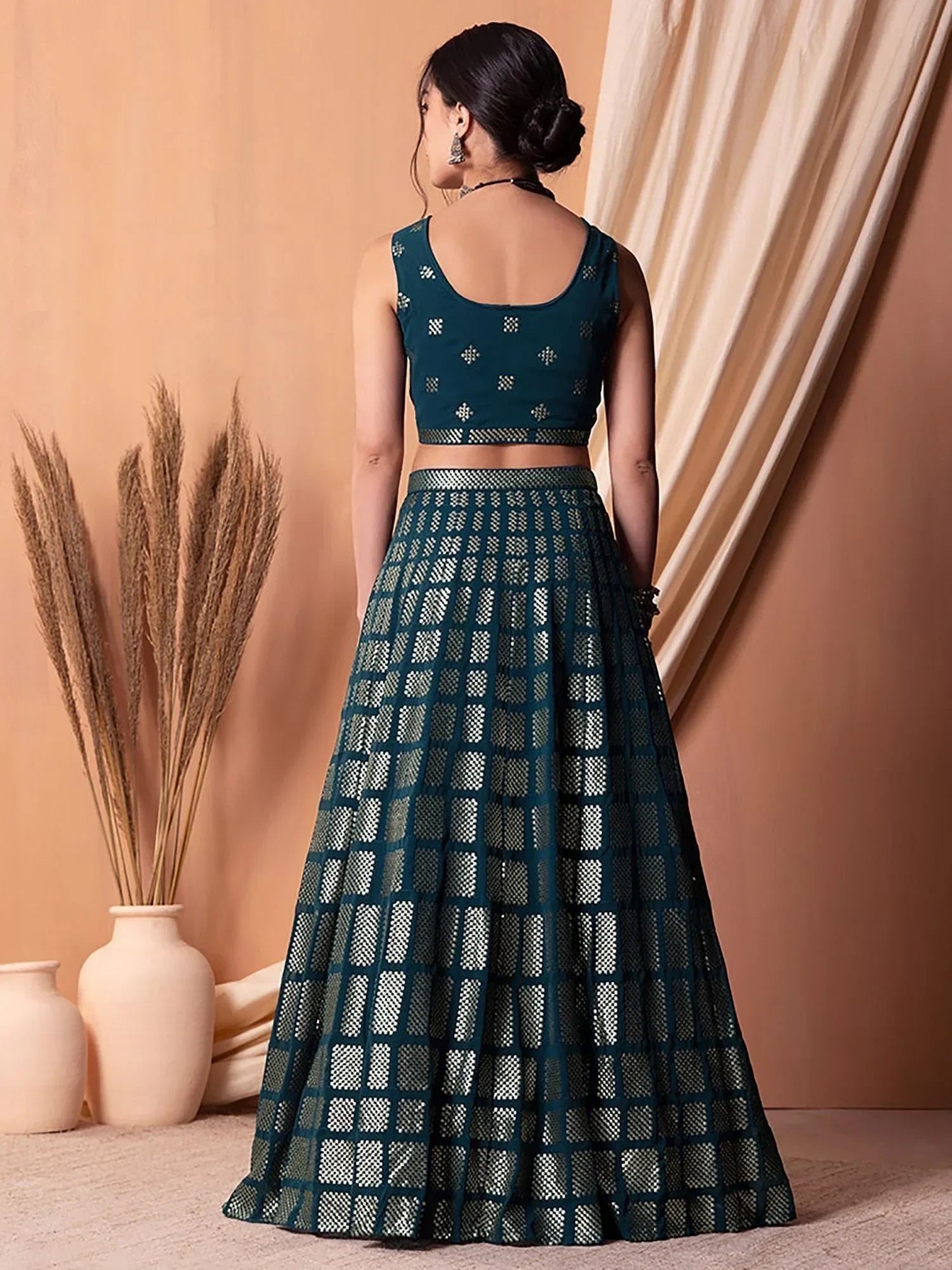 Teal designer lehenga choli with geometric pattern, back view, ethnic wear for women