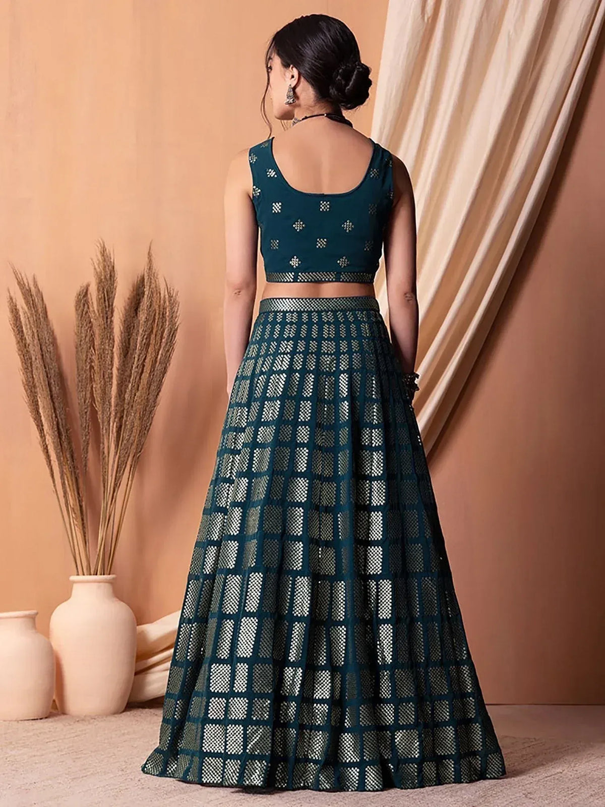 Teal designer lehenga choli with geometric pattern, back view, ethnic wear for women