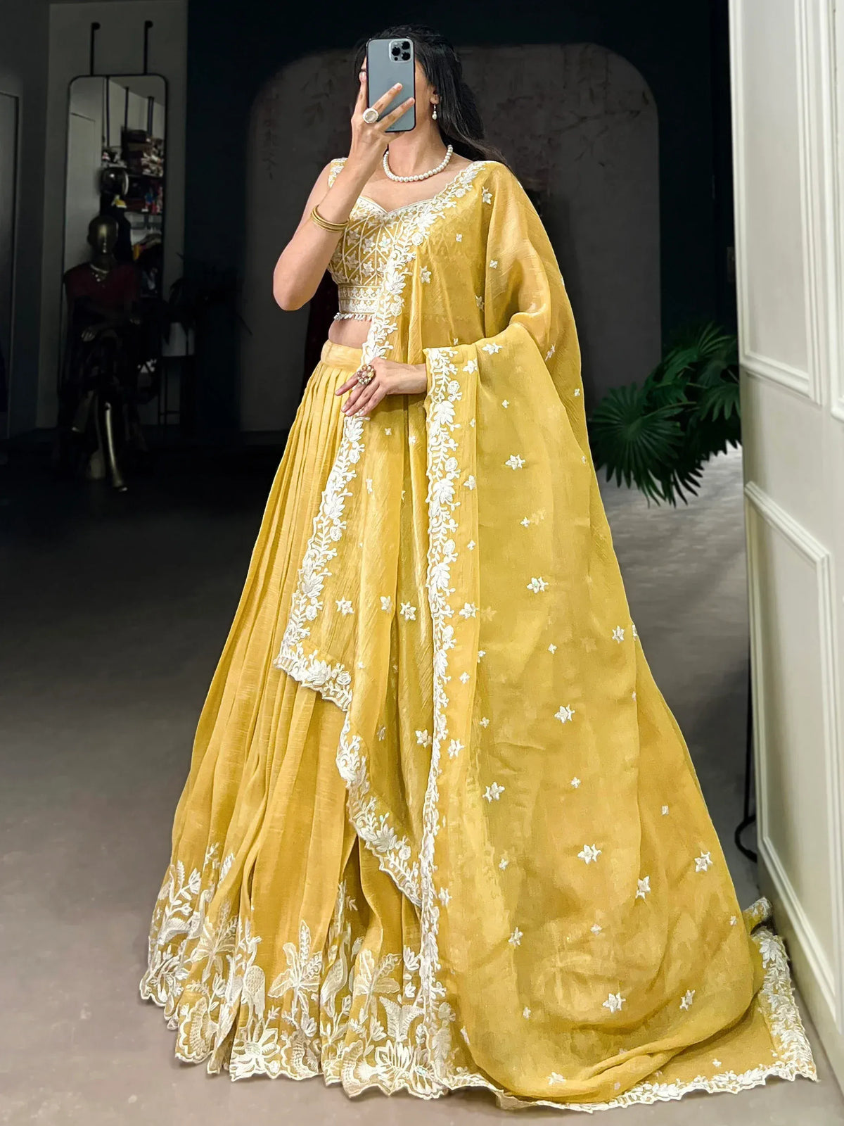 Yellow designer lehenga choli with white floral embroidery, perfect for Indian ethnic wear occasions