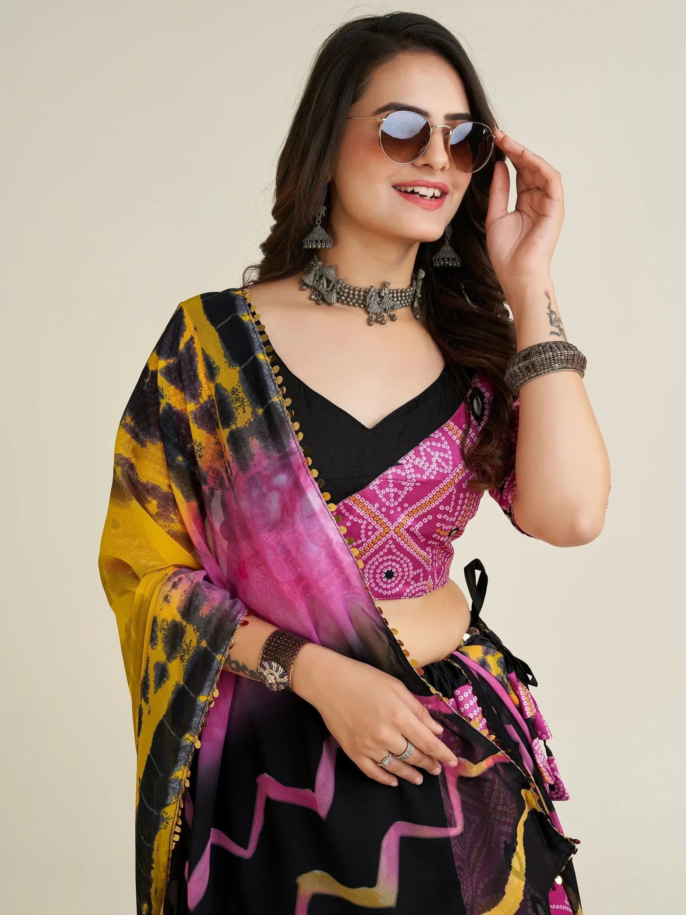 Stylish Indian ethnic wear with colorful printed dupatta, black and pink blouse, and traditional jewelry