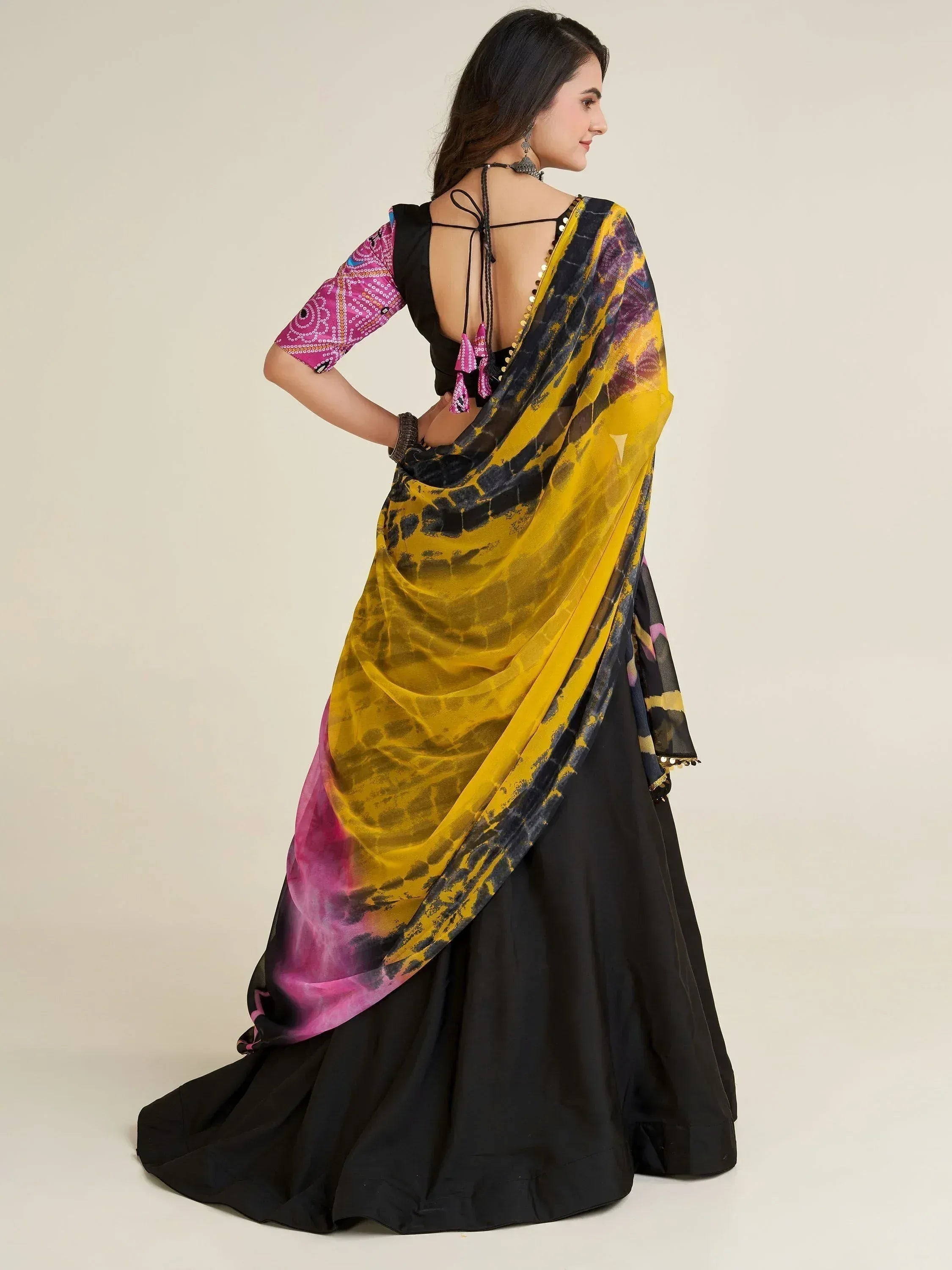Black lehenga with yellow and pink tie-dye dupatta, back view, ethnic wear