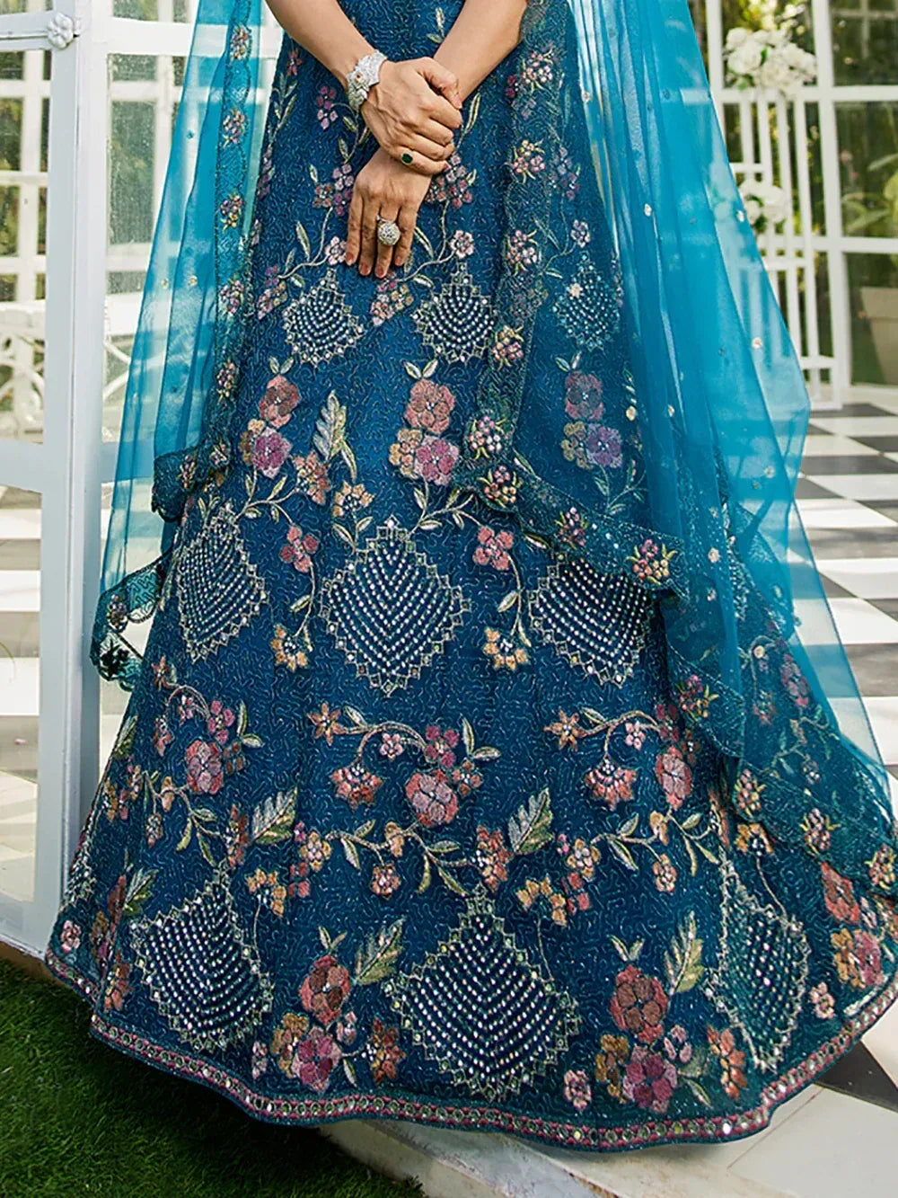 Blue floral embroidered lehenga choli with sheer dupatta, perfect for Indian ethnic occasions