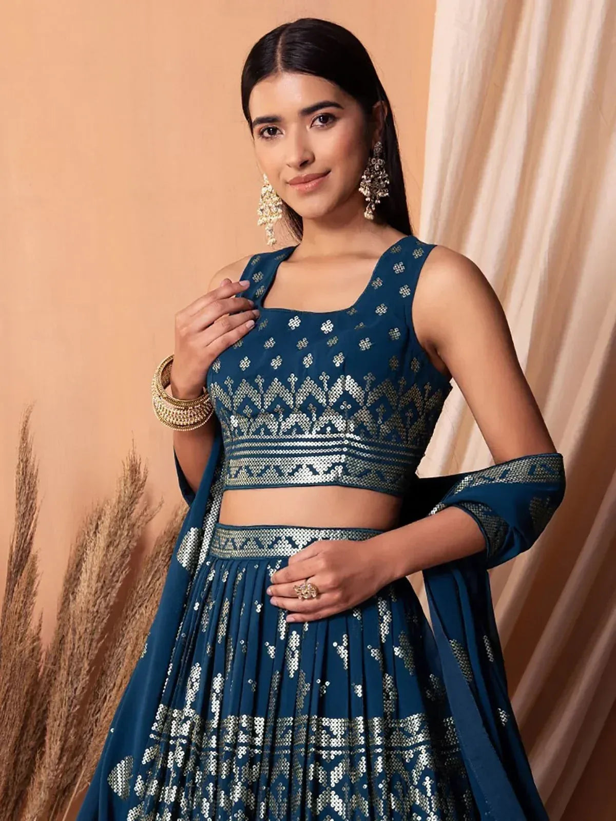 Blue embroidered lehenga choli with gold detailing, perfect for Indian ethnic wear occasions