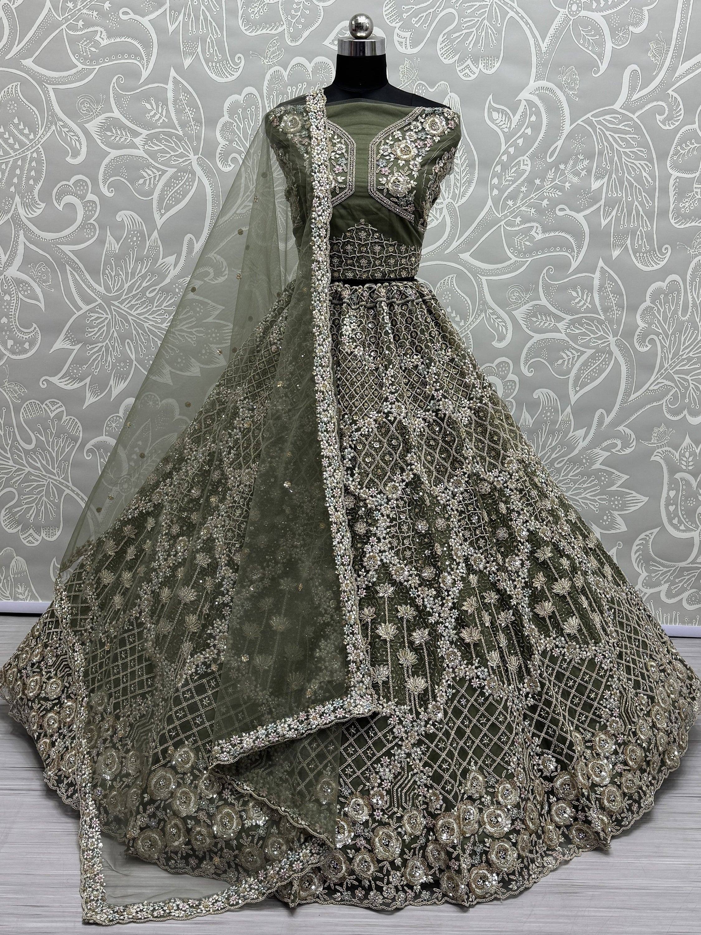 Olive green designer lehenga choli with heavy silver embroidery and net dupatta, perfect for Indian weddings.