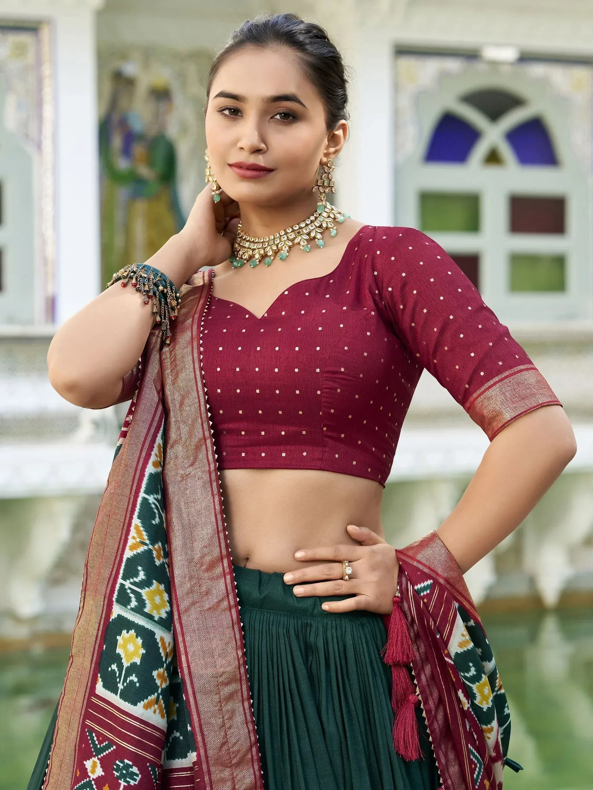 Maroon embroidered blouse with green pleated skirt and patterned dupatta, Indian ethnic wear