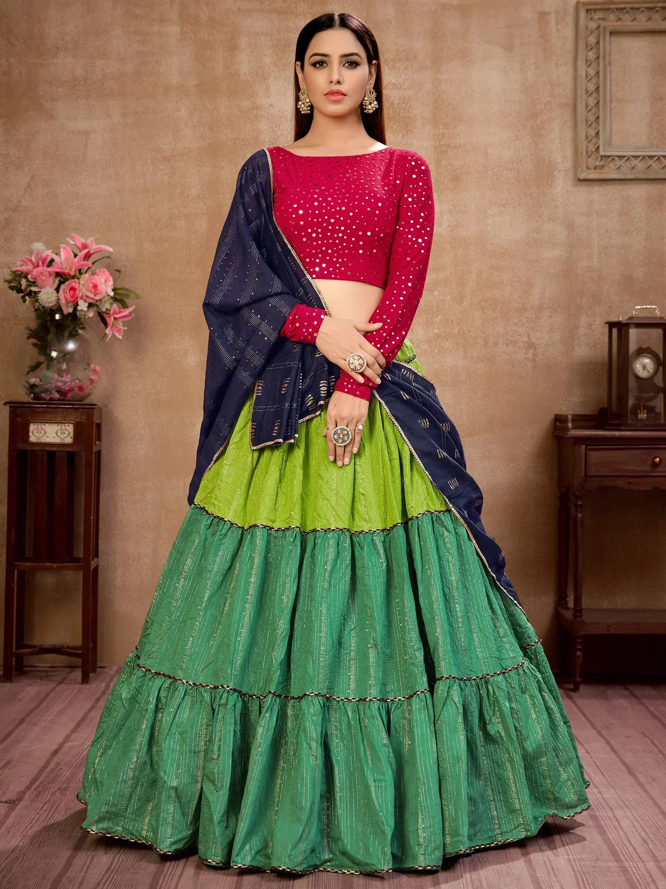 Vibrant green and red designer lehenga choli with sequin blouse and navy dupatta, perfect for Indian ethnic occasions