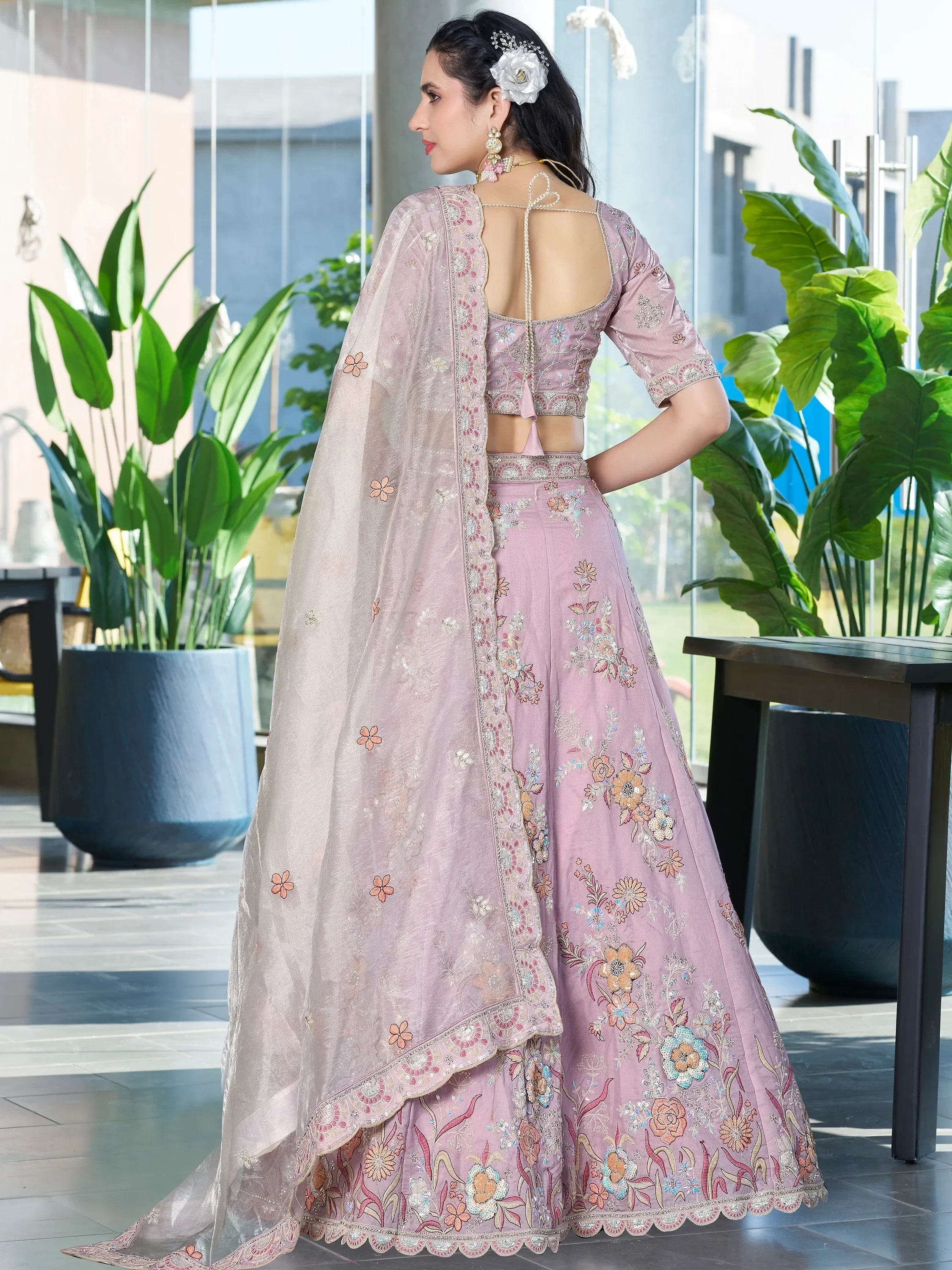 Pink floral embroidered lehenga choli with back tie blouse and sheer dupatta, perfect for Indian weddings or parties