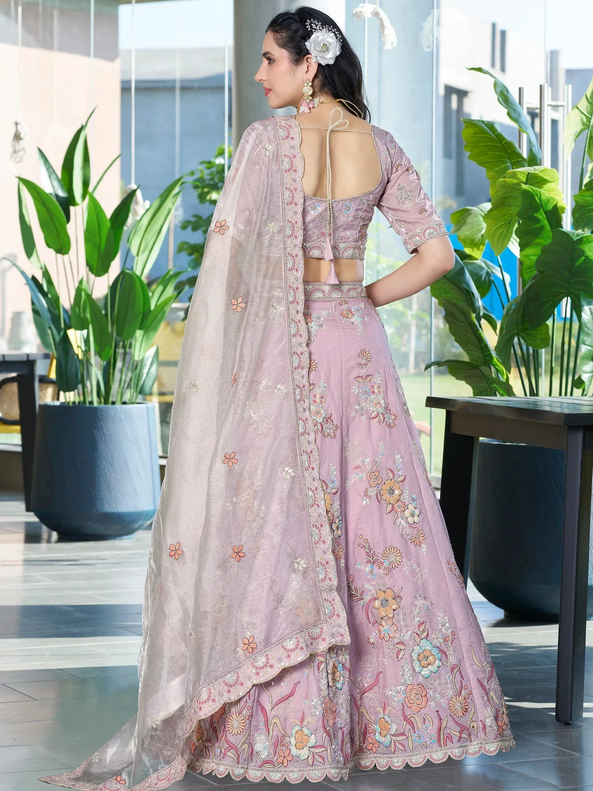 Pink floral embroidered lehenga choli with back tie blouse and sheer dupatta, perfect for Indian weddings or parties