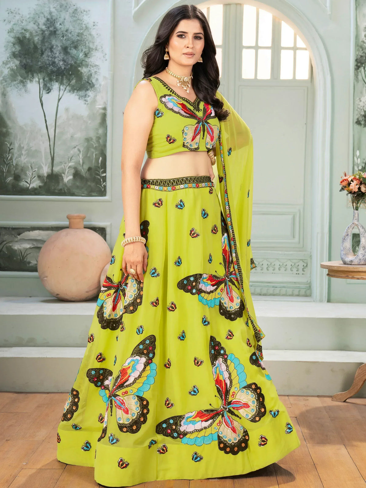 Lime green lehenga choli with colorful butterfly embroidery, perfect for Indian ethnic wear occasions.
