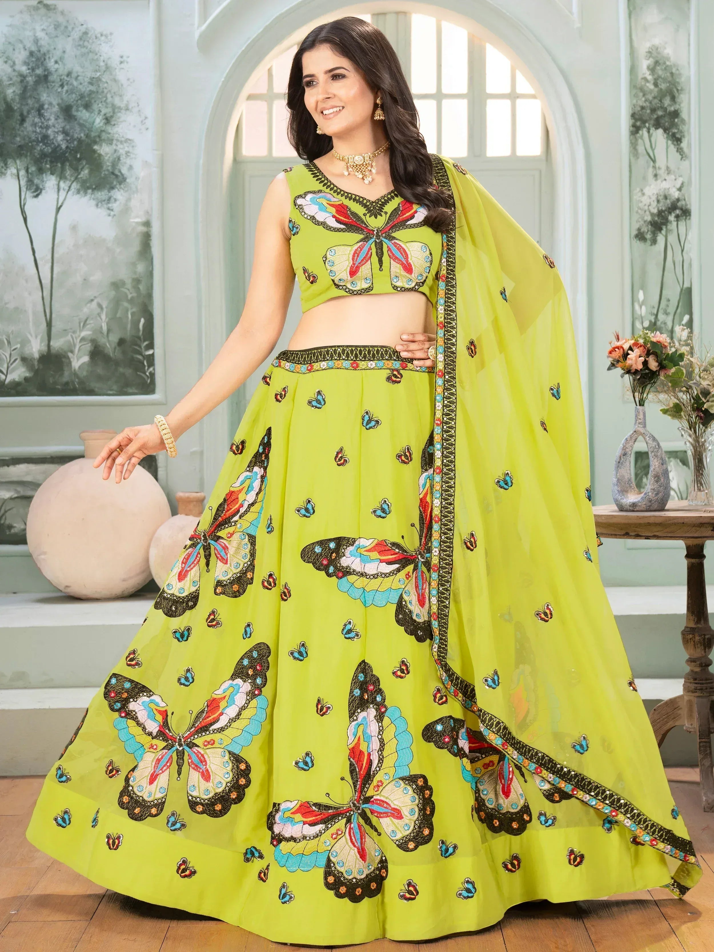 Lime green lehenga choli with colorful butterfly embroidery, perfect for Indian ethnic wear events.