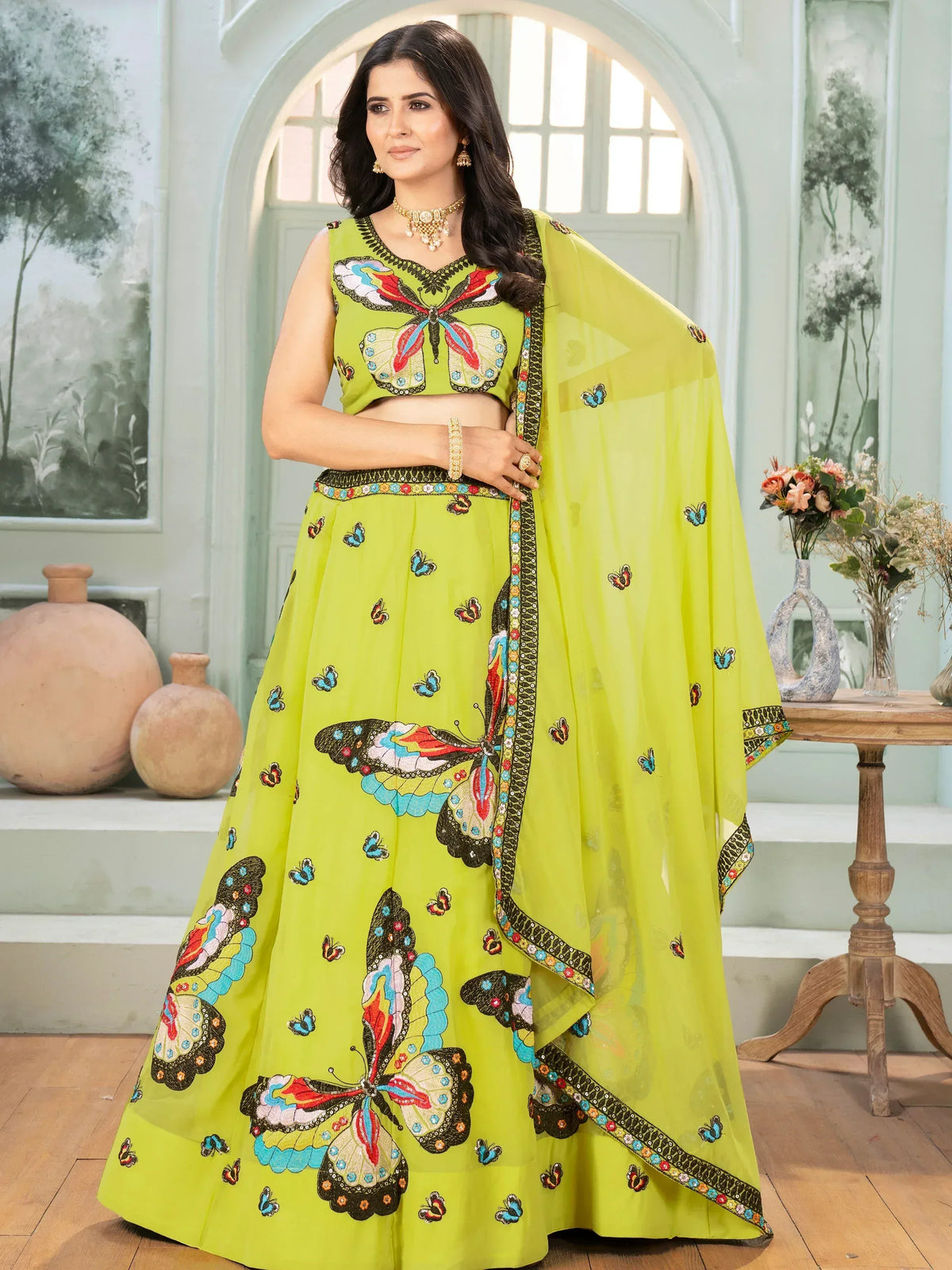 Vibrant lime green lehenga choli with colorful butterfly embroidery, perfect for Indian ethnic wear occasions.