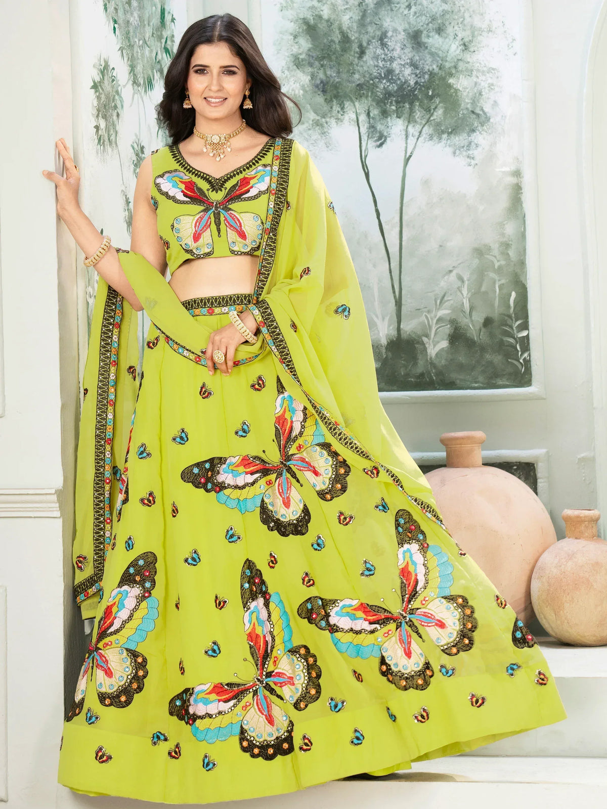 Lime green lehenga choli with colorful butterfly embroidery, perfect for Indian ethnic wear events.