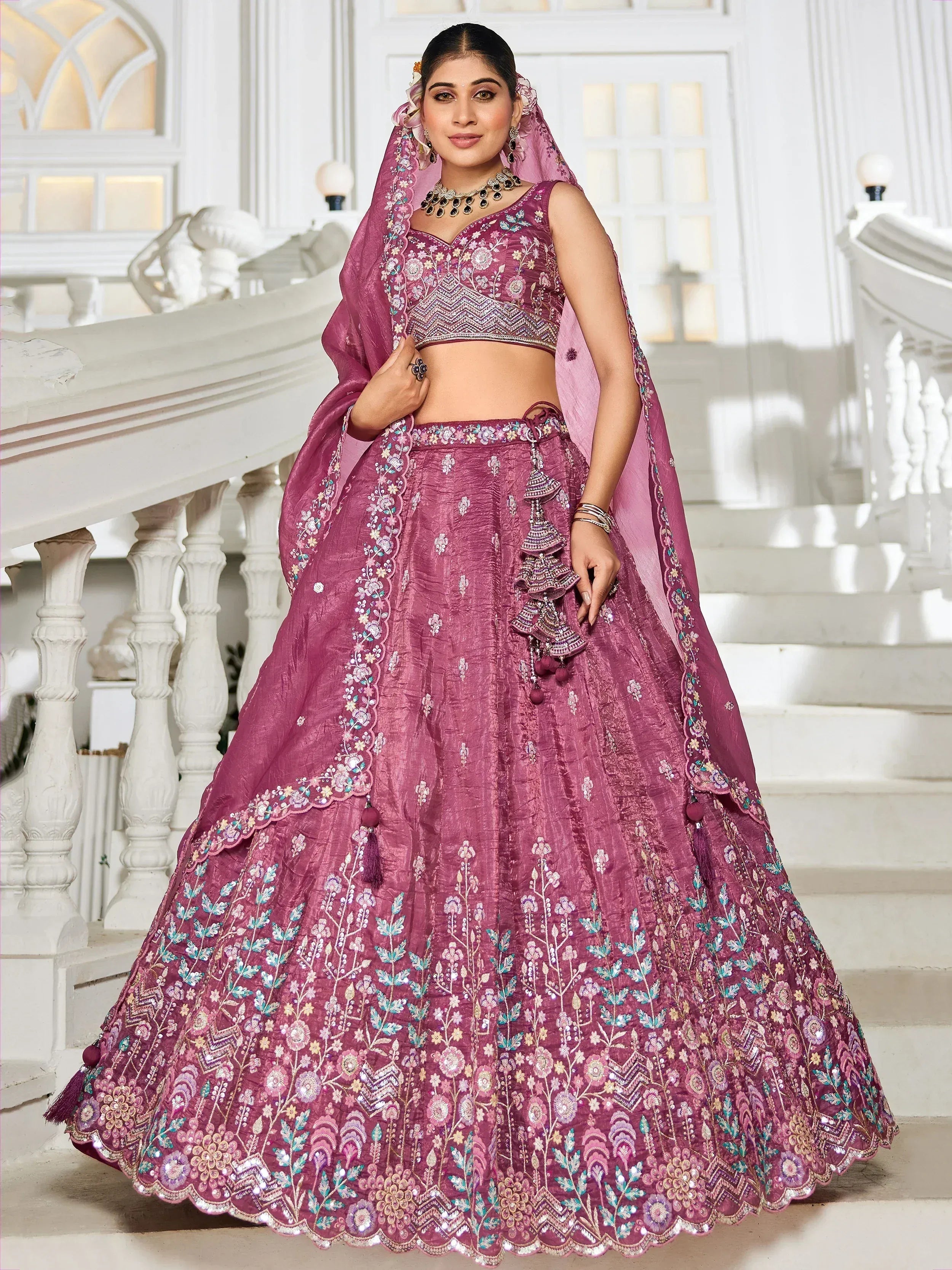 Elegant purple lehenga choli with floral embroidery, perfect for Indian weddings and festive occasions.
