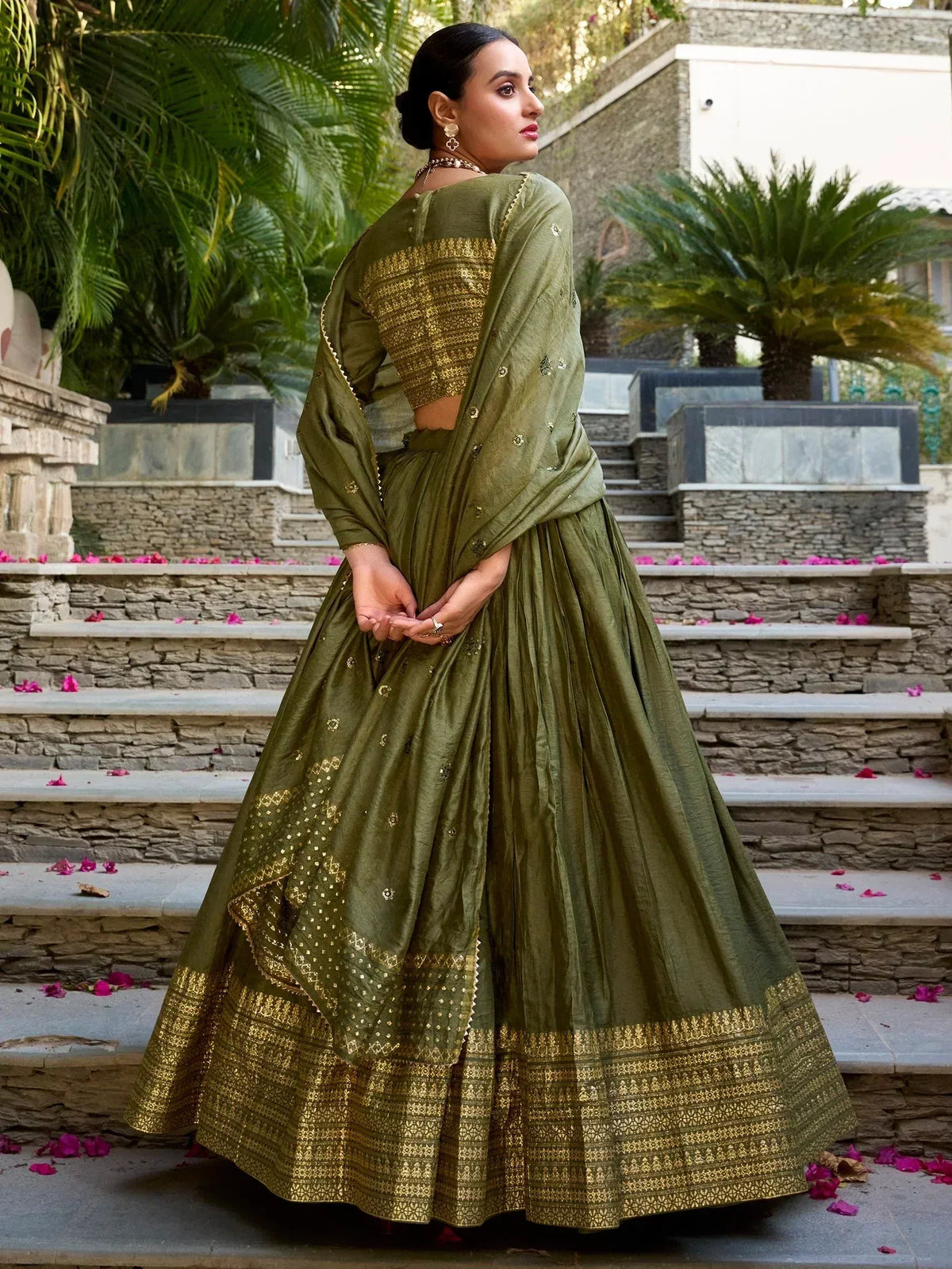 Olive green designer lehenga choli with gold embroidery, perfect for Indian ethnic wear occasions.