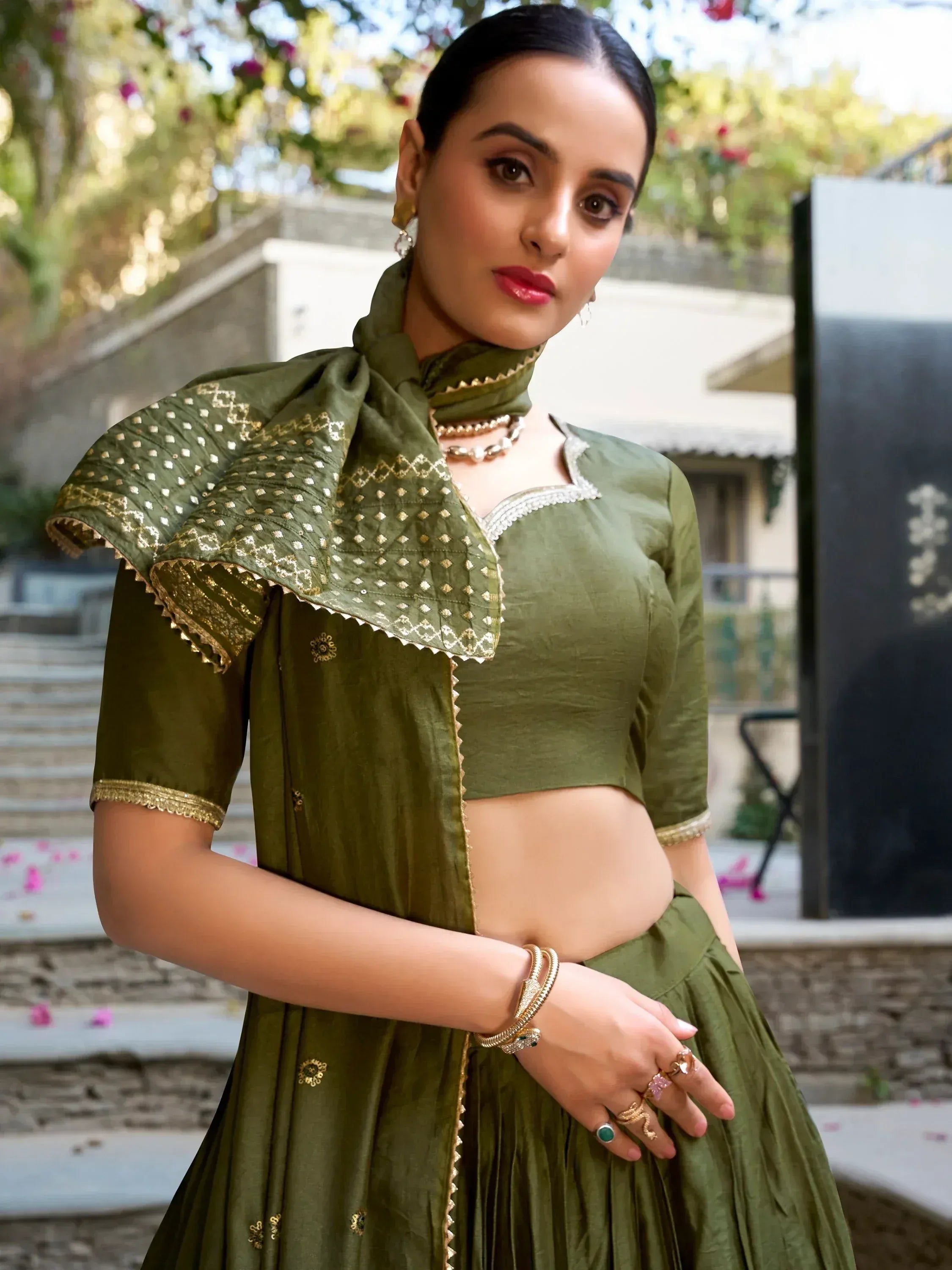 Olive green designer lehenga choli with gold embroidery, perfect for Indian ethnic wear and festive occasions.