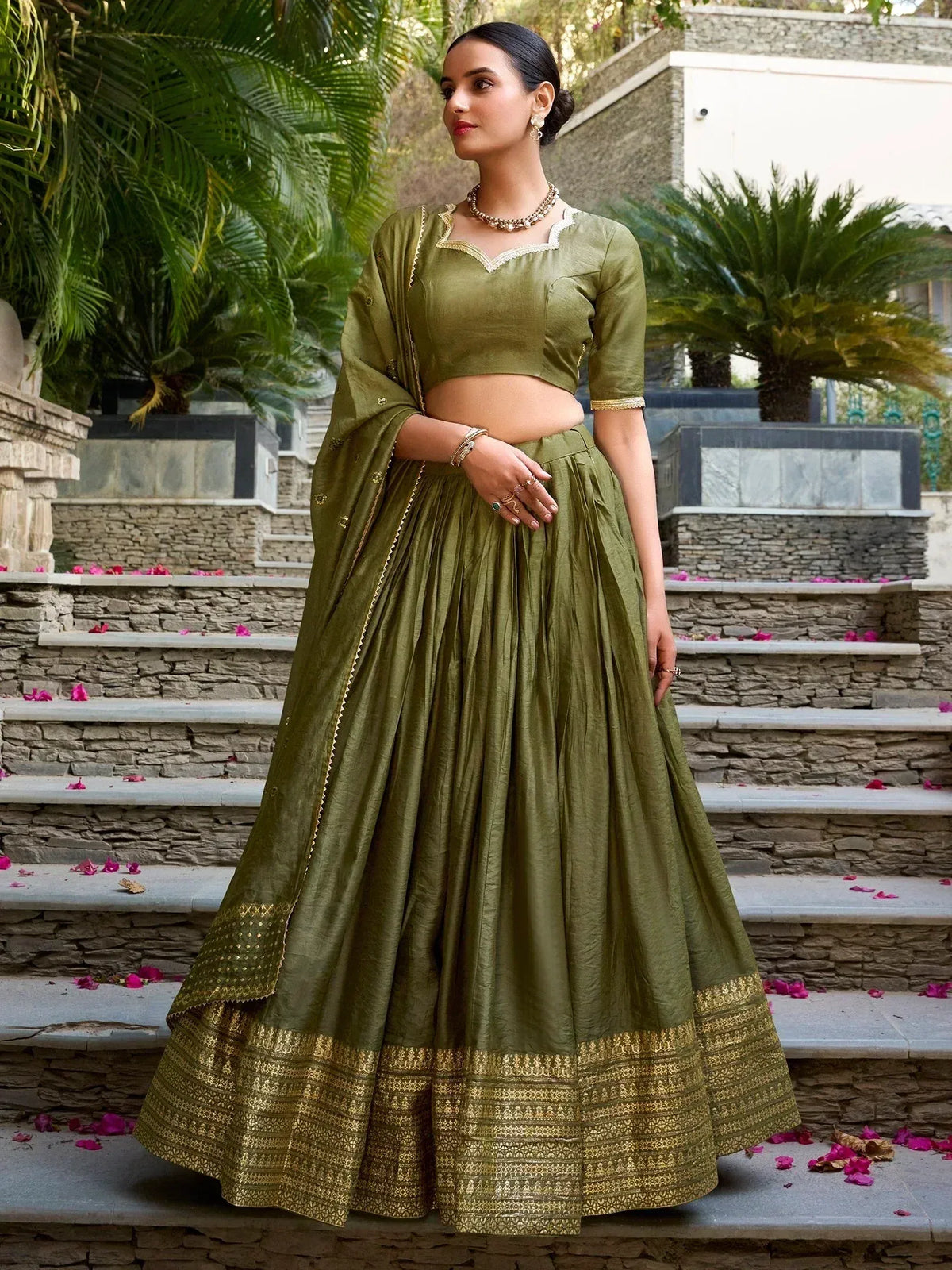 Olive green designer lehenga choli with gold embroidery, perfect for Indian ethnic wear and festive occasions.