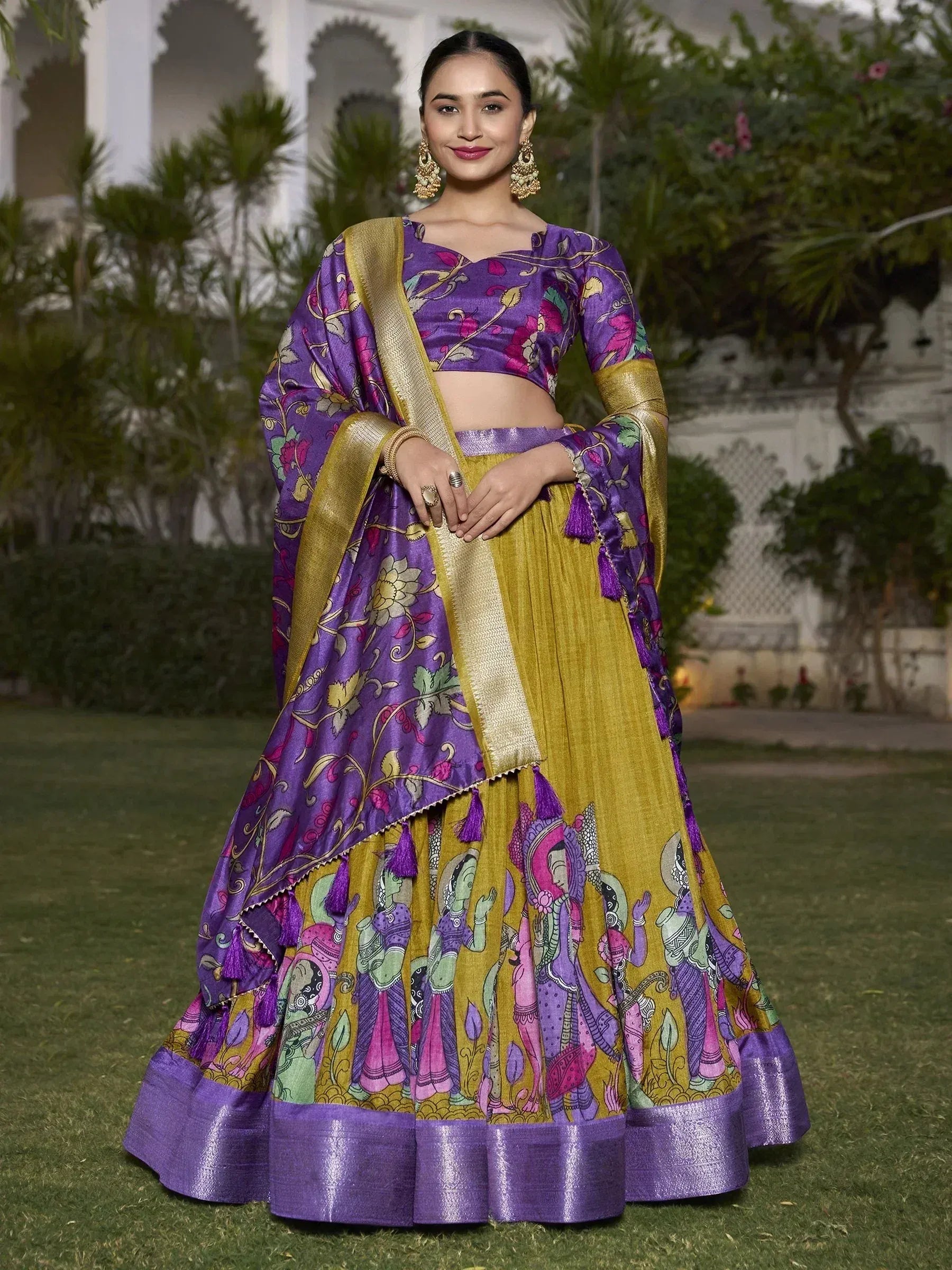 Purple and gold printed lehenga choli with floral and folk art design, perfect for Indian ethnic occasions.