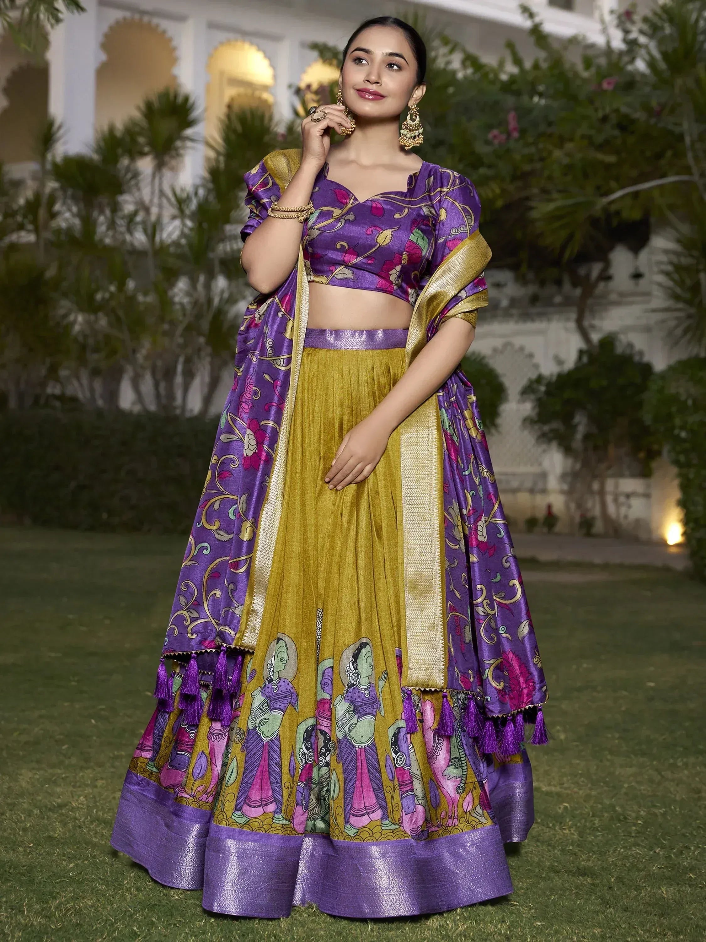 Purple and gold printed lehenga choli with ethnic motifs, perfect for Indian weddings and festive occasions.