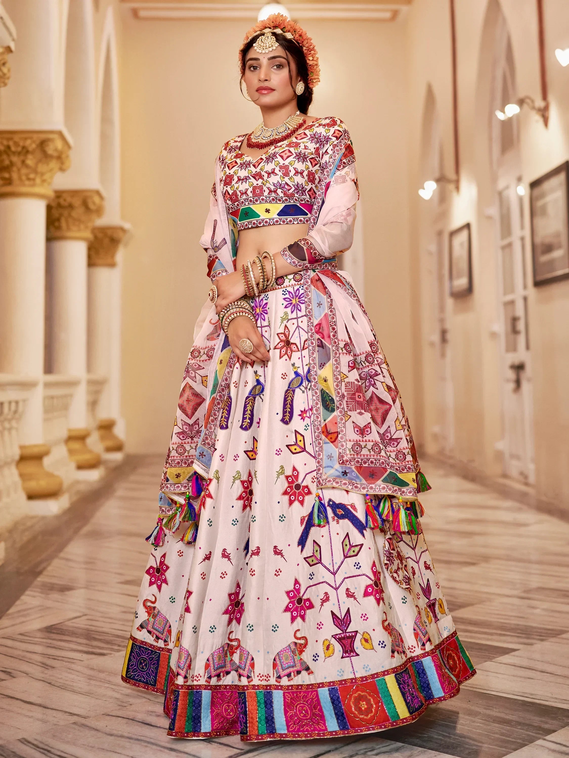 Colorful embroidered lehenga choli with floral and elephant motifs, perfect for Indian ethnic wear occasions