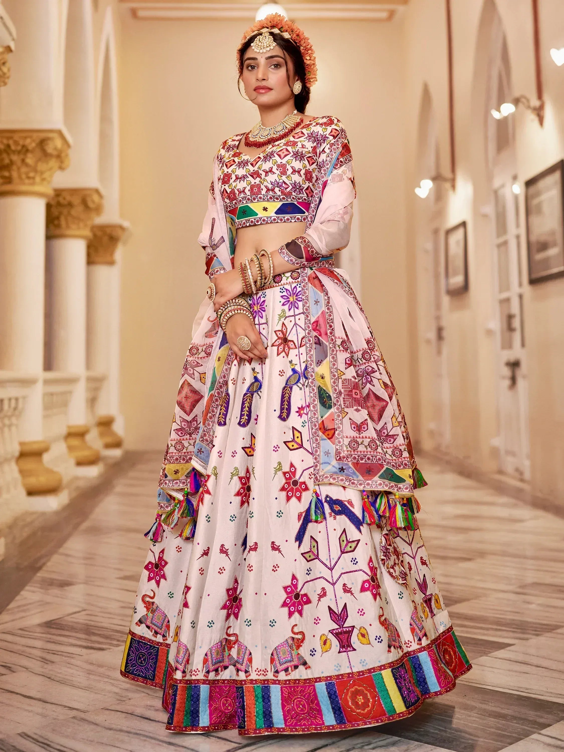 Colorful embroidered lehenga choli with floral and elephant motifs, perfect for Indian ethnic wear occasions